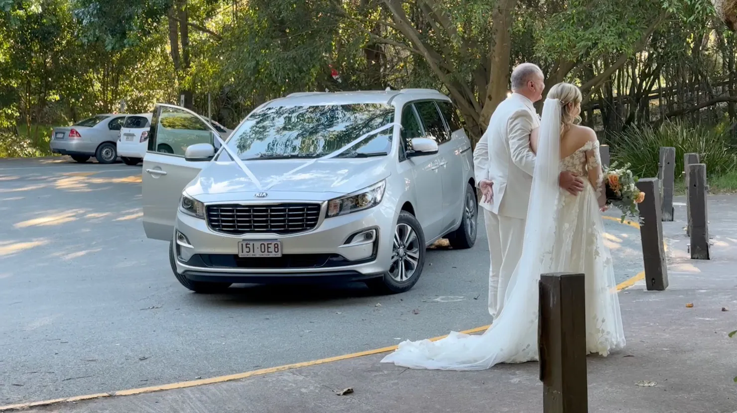 Bride and Father of the Bride with a Transfers to Noosa vehicle providing wedding transport