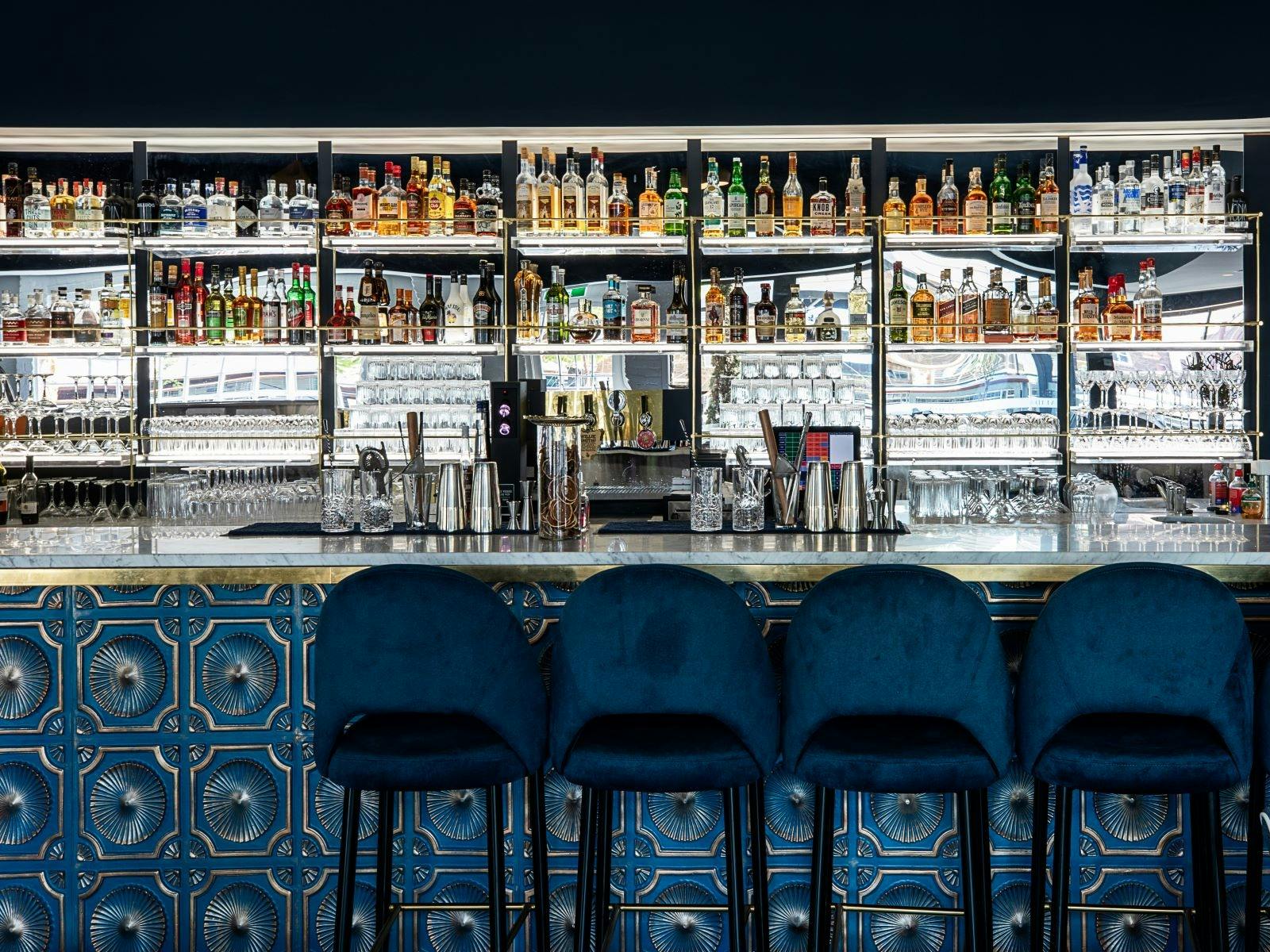 Bar with variety of drinks and glassware