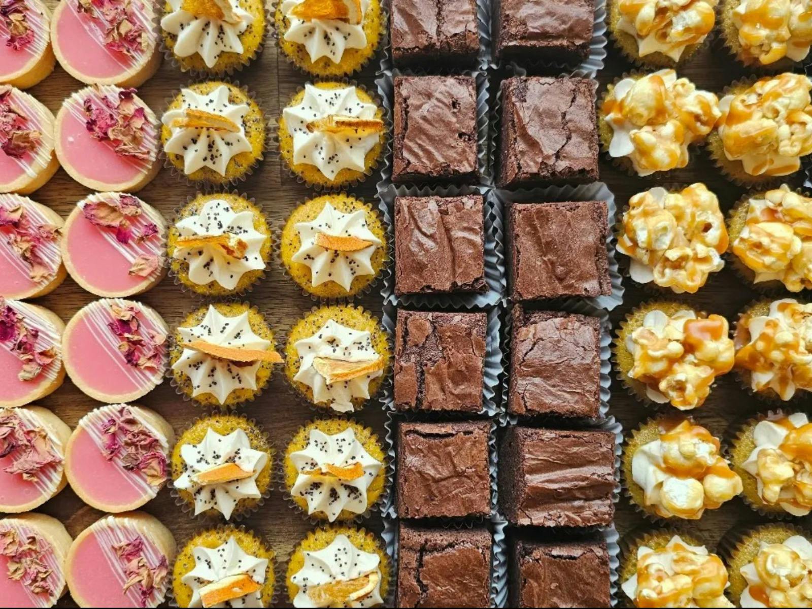 Various beautiful sweet treats in perfect lines.