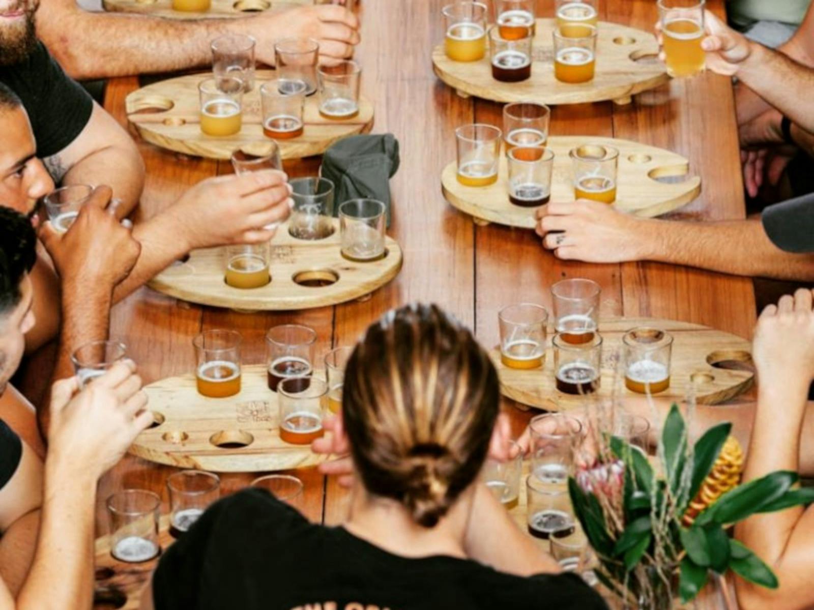 Group enjoying tasting flights of beer