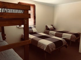 One of the bedrooms with two singles and a bunk bed