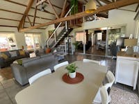 Spacious main lounge/dining area, one of multiple indoor/outdoor sitting/dining areas at the retreat