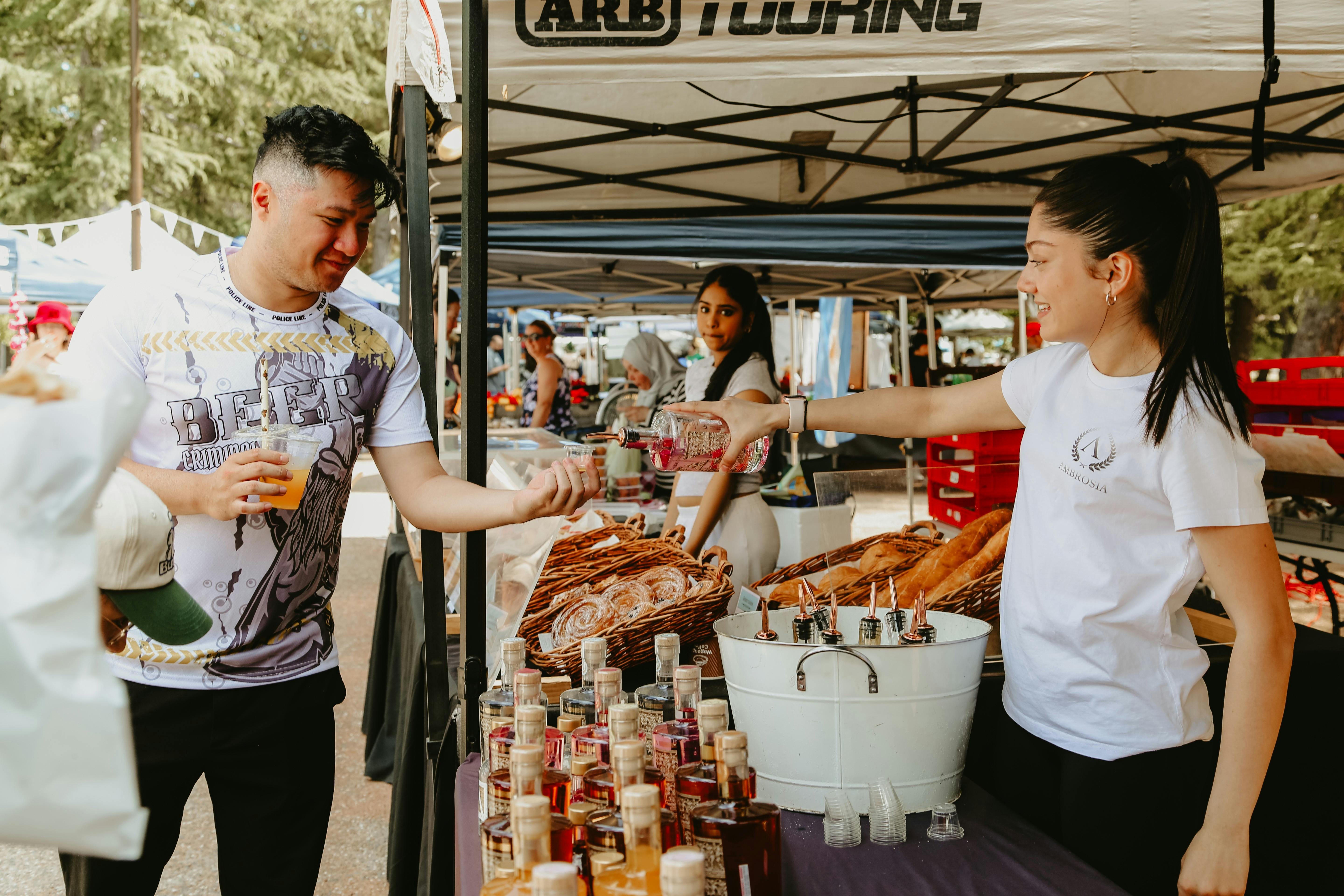 A visitor tasting a sample of vodka from Ambrosia Distillery