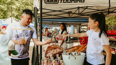 A visitor tasting a sample of vodka from Ambrosia Distillery