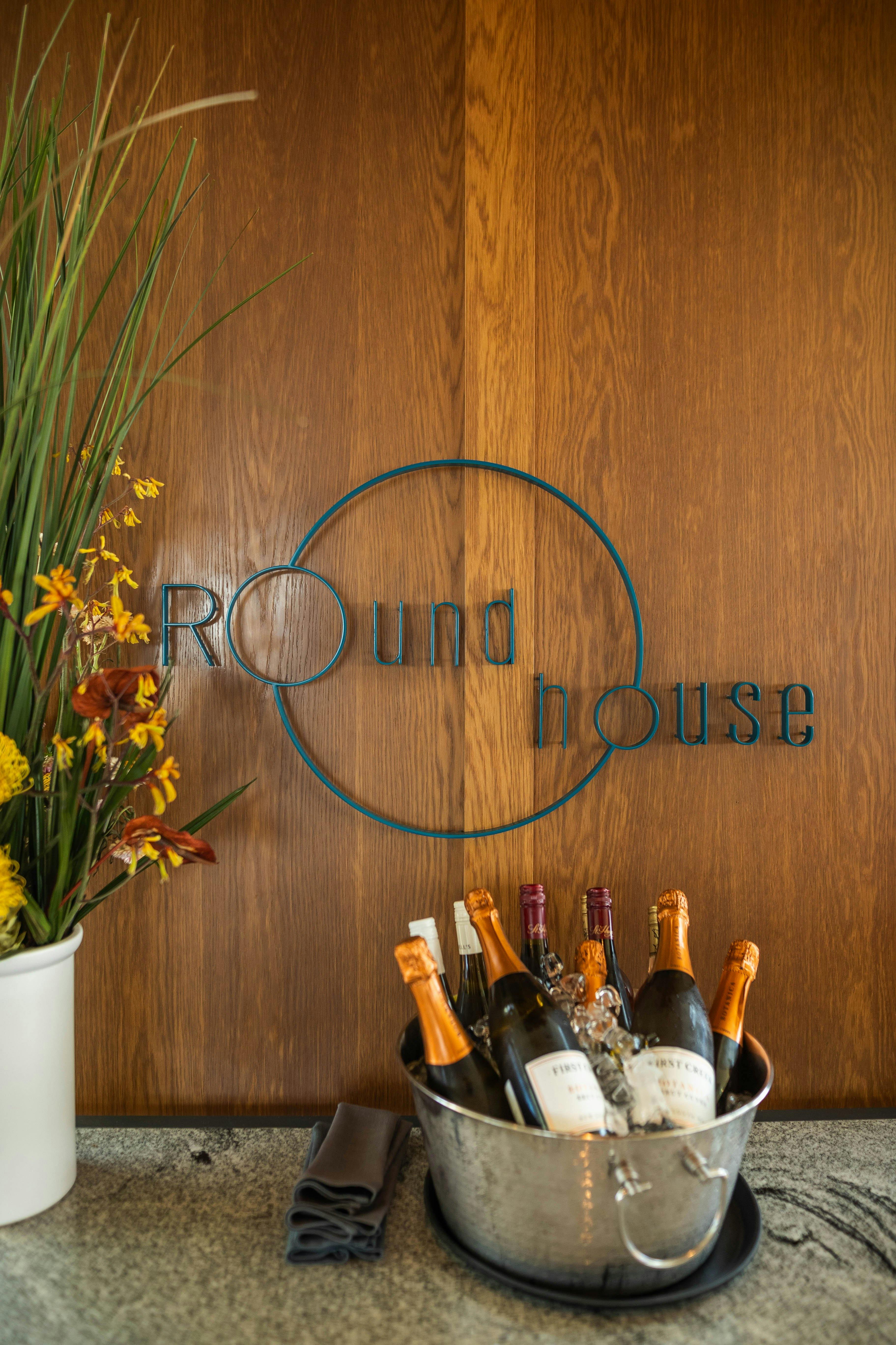 Bucket of alcohol in front of Roundhouse sign