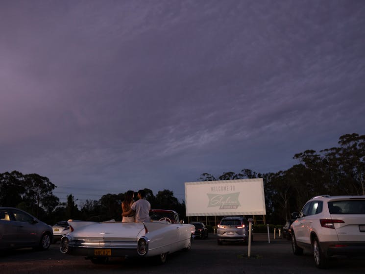 Couple sitting in their car ready to watch a movie at the Skyline Drive In Blacktown