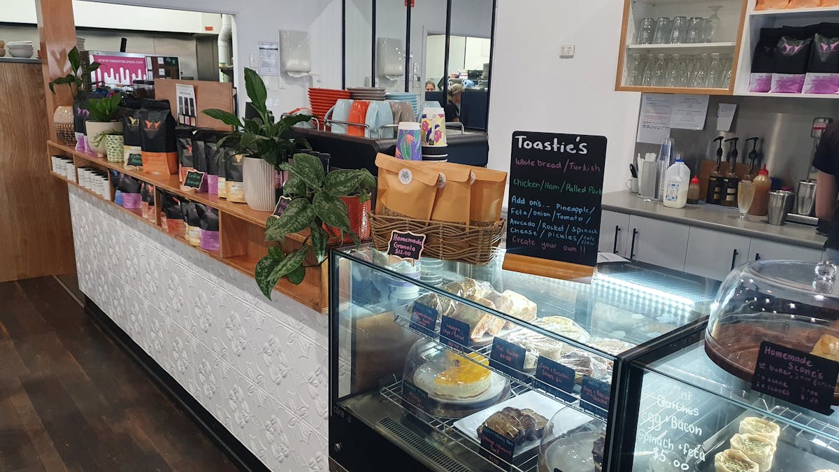 selection of cakes and savory bites at the front counter