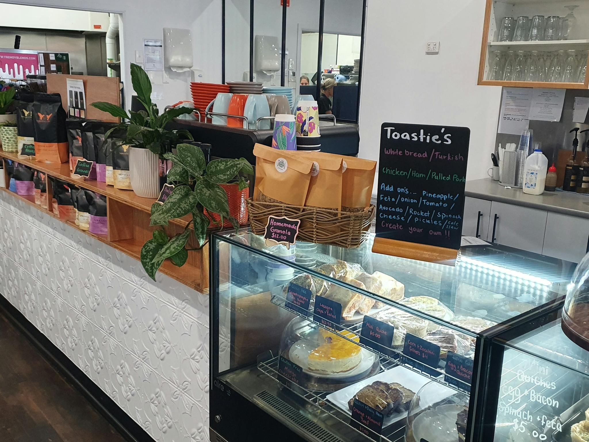 selection of cakes and savory bites at the front counter selection of cakes and savory bites at the front counter