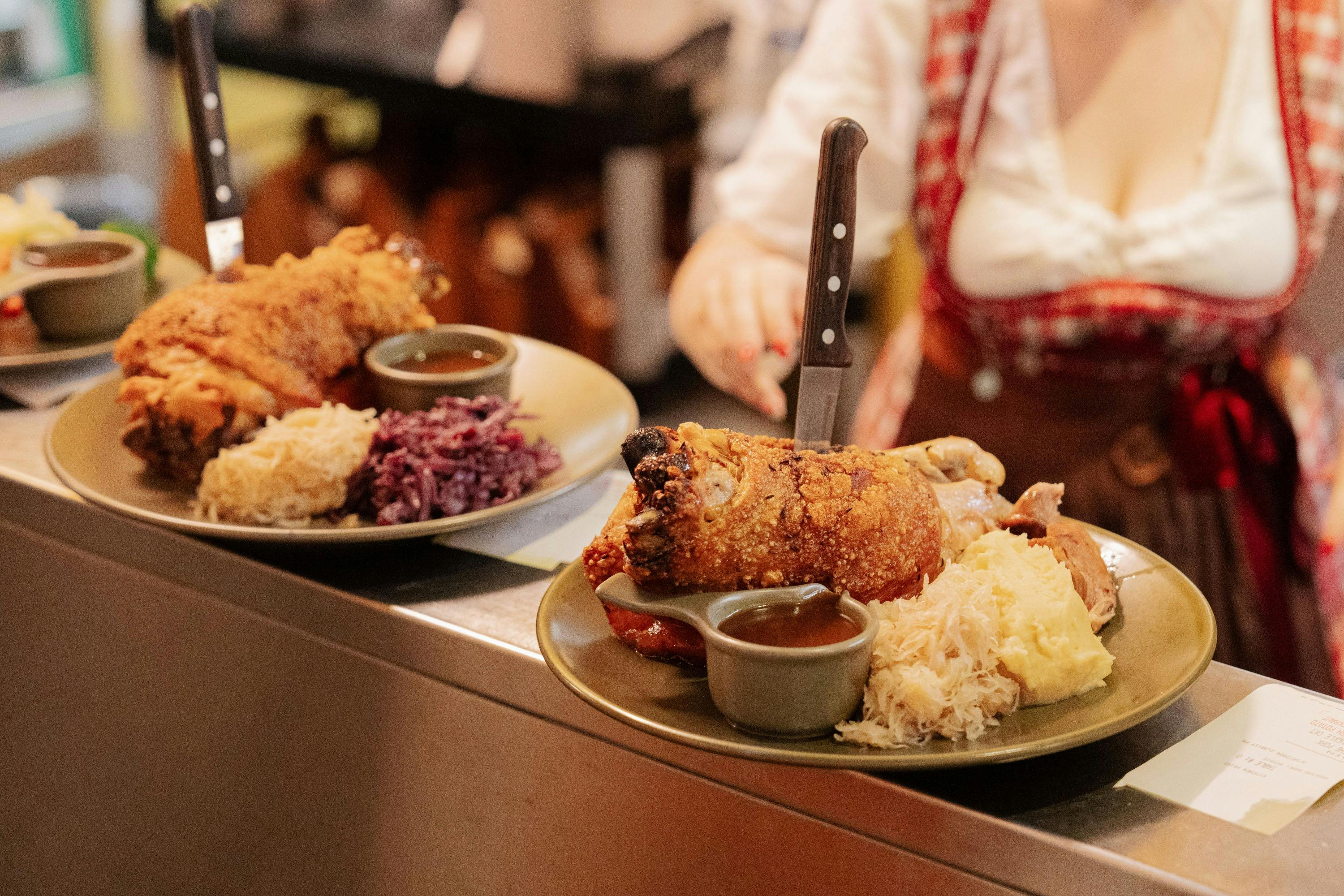 Two pork knuckles being served at Oktoberfest