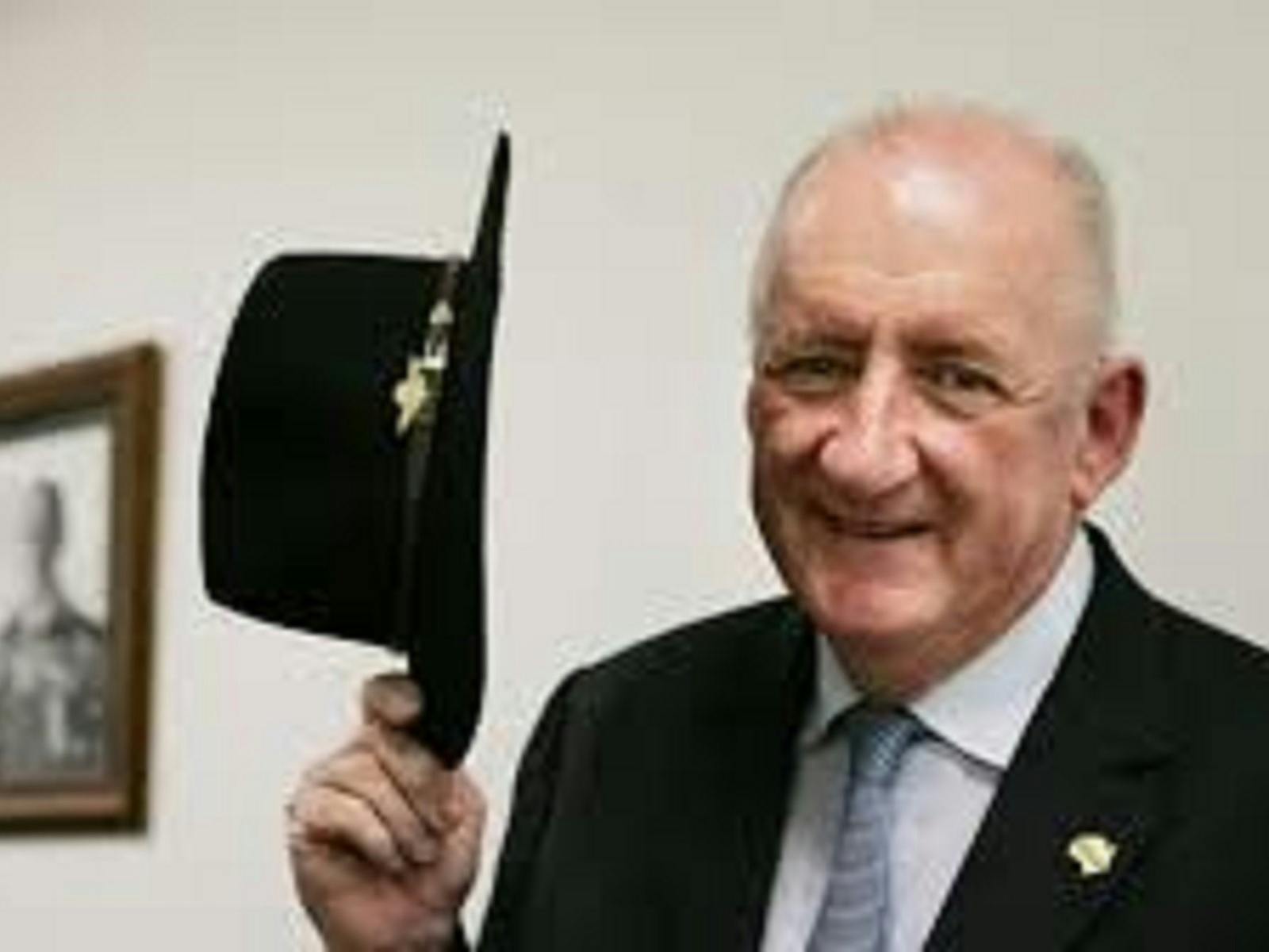 Man holding hat