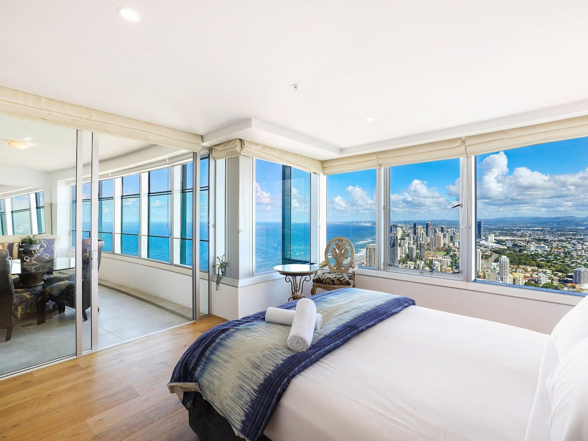 Q1 Resort Surfers Paradise, bedroom with city and ocean views, indoor balcony access from bedroom.