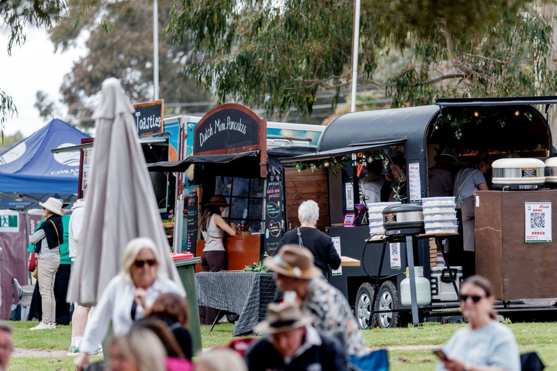 Festival goers and stalls