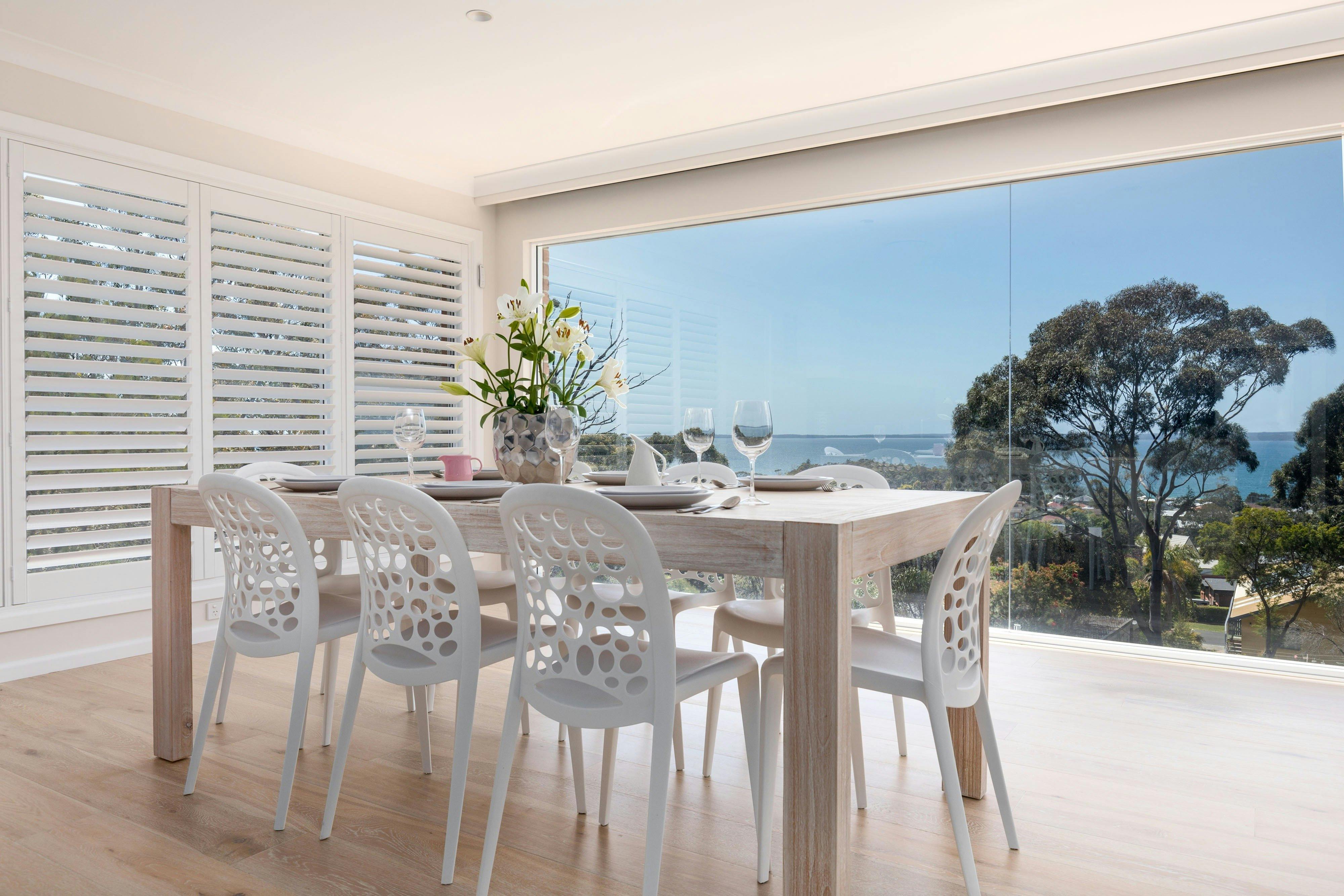 Dining area with floor to ceiling windows