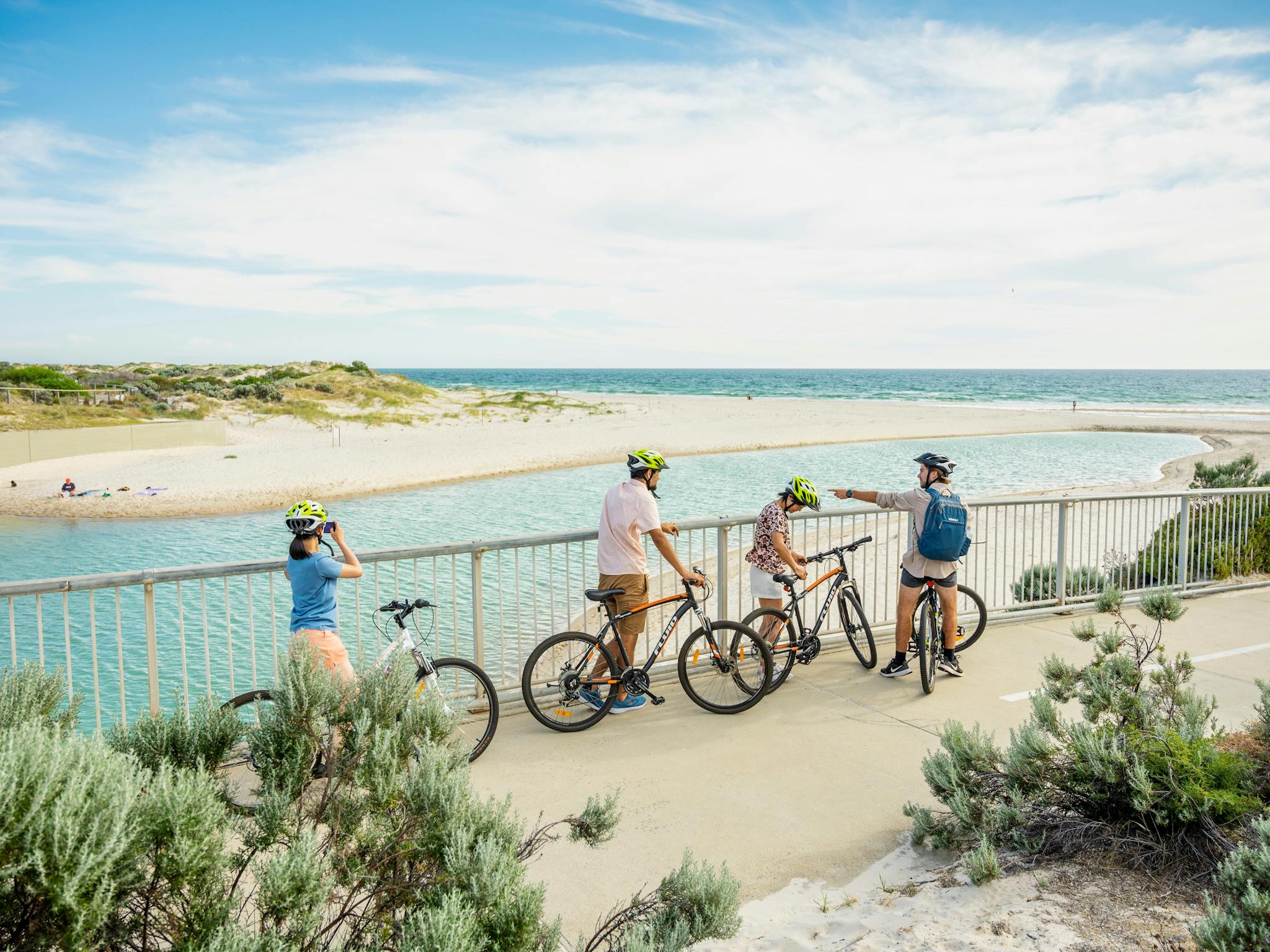 Riders stop and take a moment to take in the view of the beach