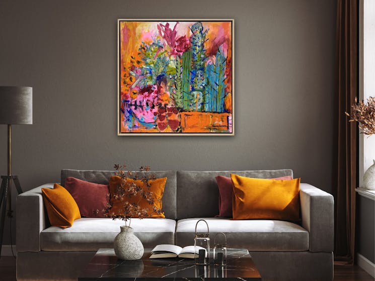 Inspired by a trip to Mexico this is a floral painting in orange, pink and blue tones with cactus