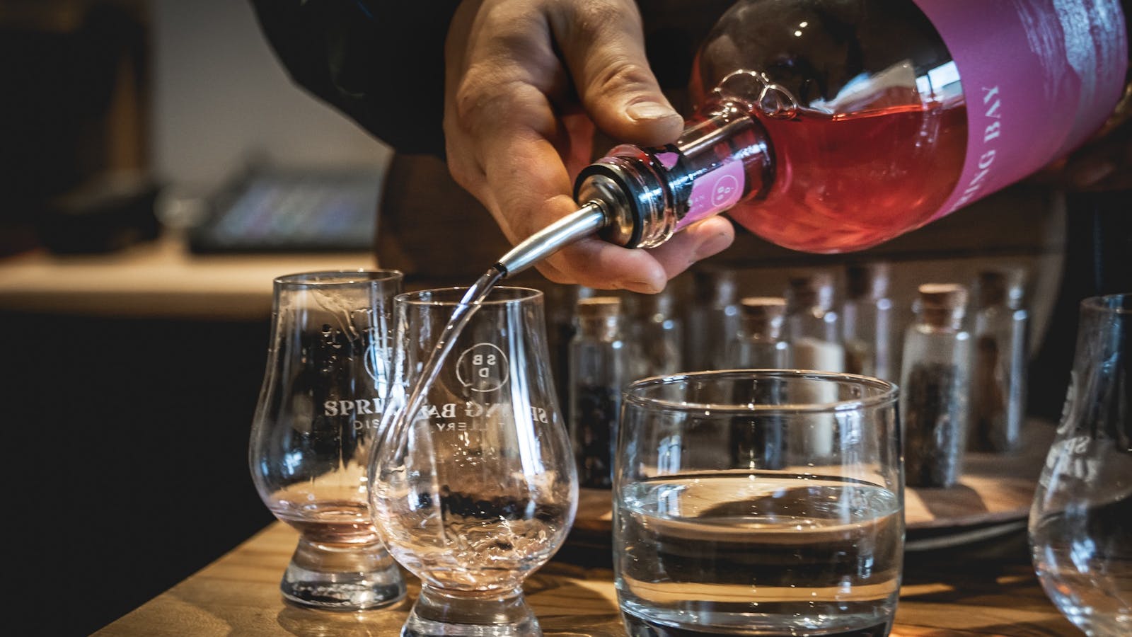 Pouring and sampling Gins at Spring Bay Distillery