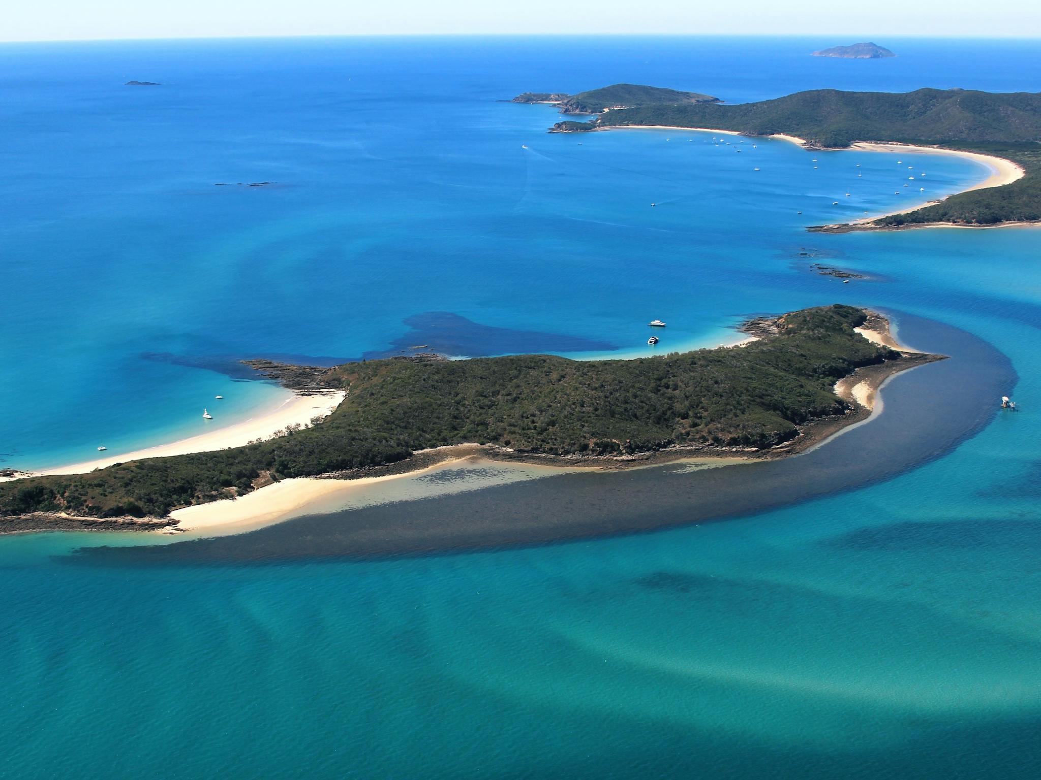 photo of island and water surrounding photo of island and water surrounding