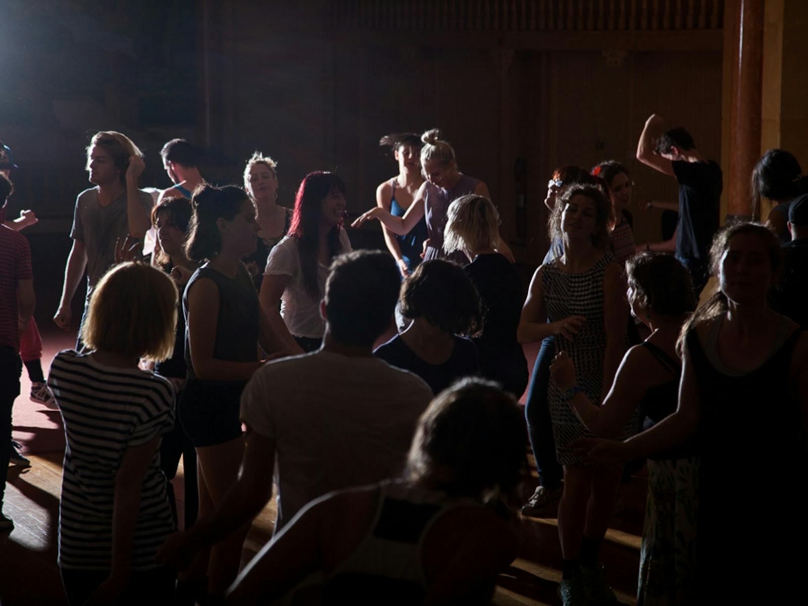 A group of people dancing at No Lights No Lycra Newtown