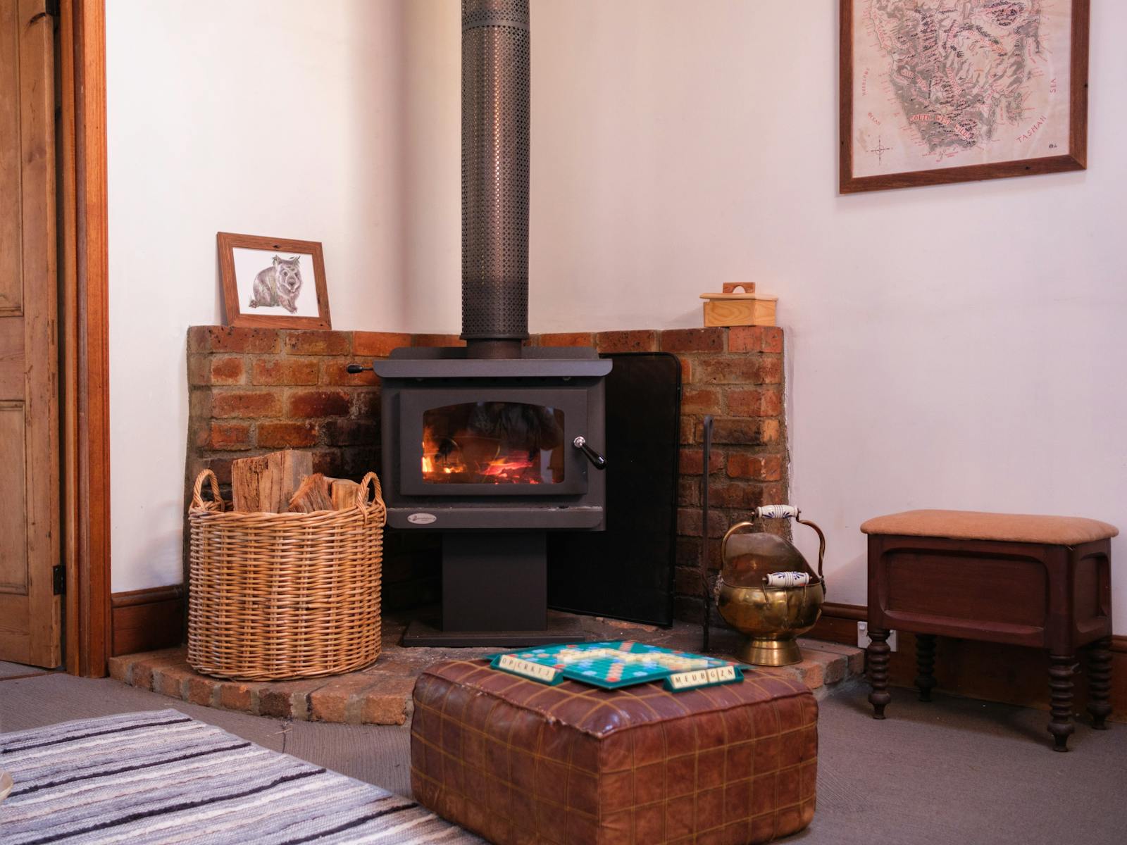 Wood fire with wood basket, and scrabble board