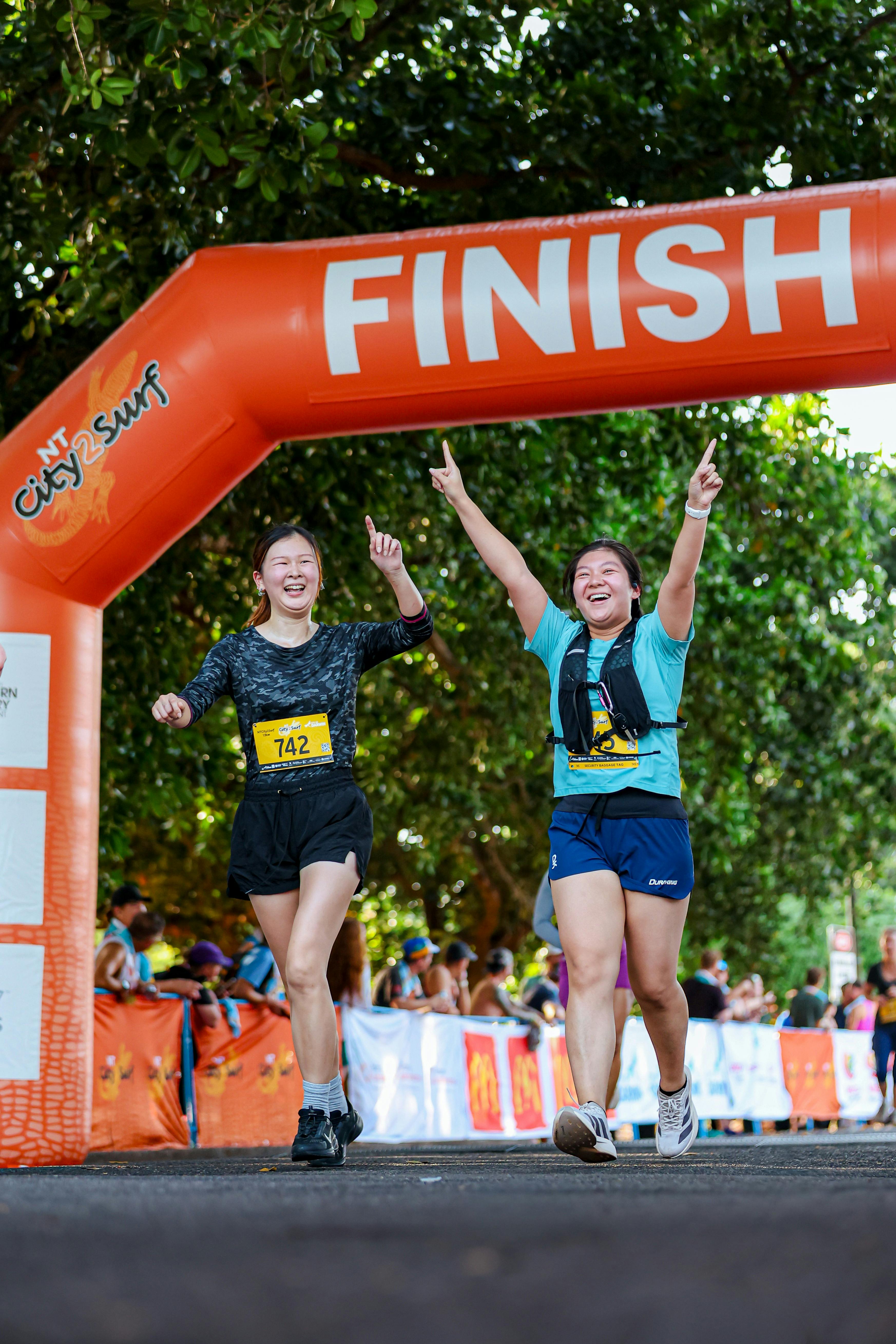 people crossing the finish line