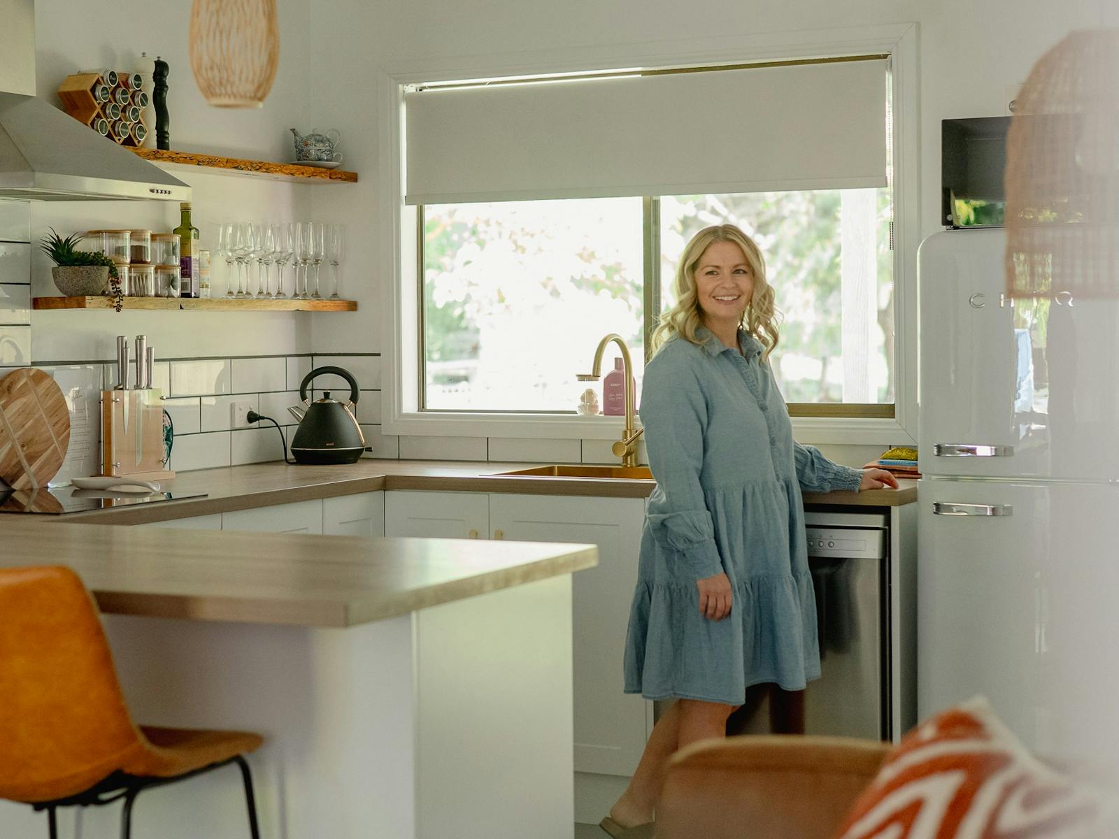 Woman standing in kitchen