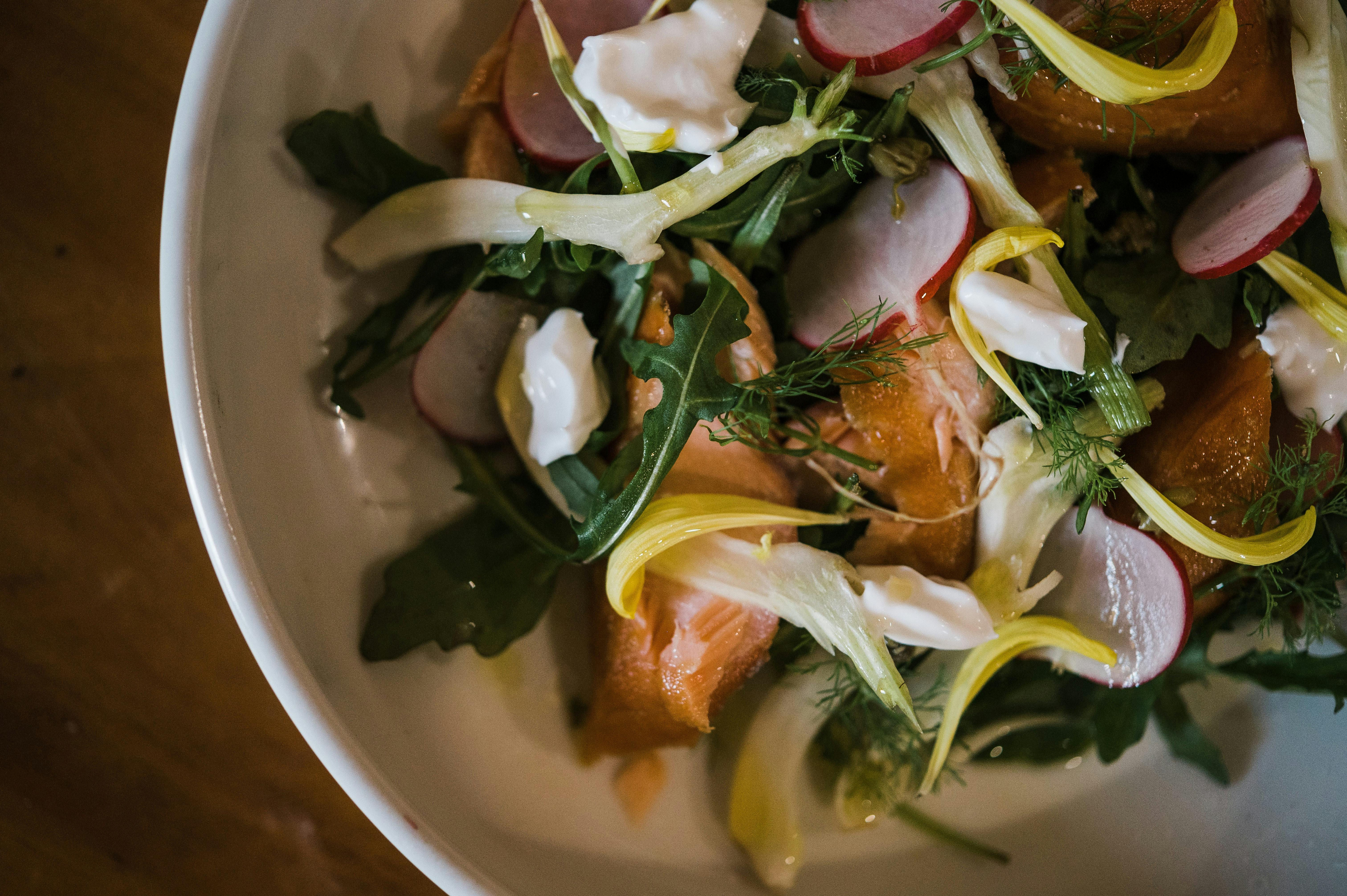 image shows salad dish with Smoked Salmon product