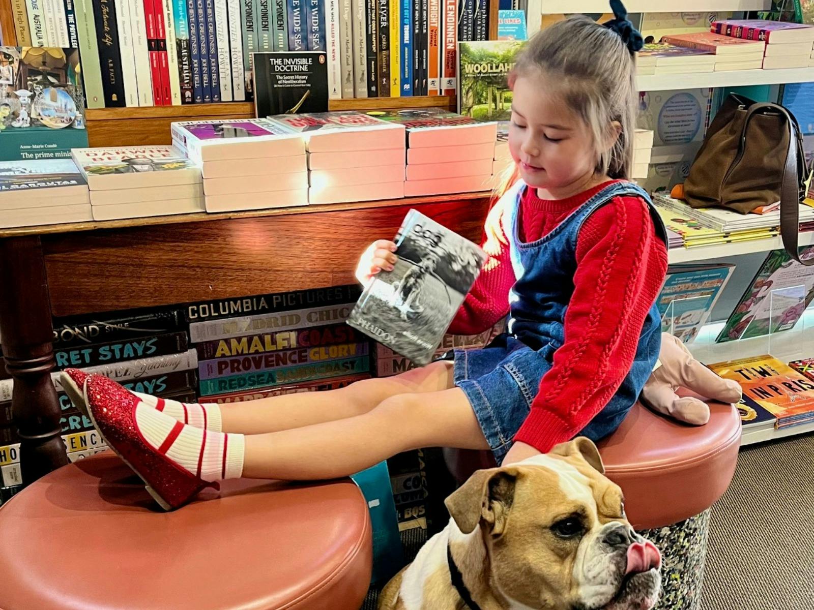 little girl and dog at Woollahra Bookshop