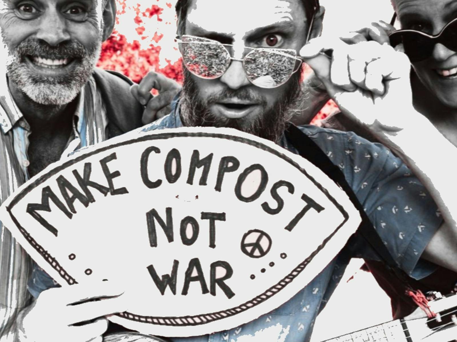 Formidable Vegetable hold a sign that says "make compost not war" Formidable Vegetable hold a sign that says "make compost not war"