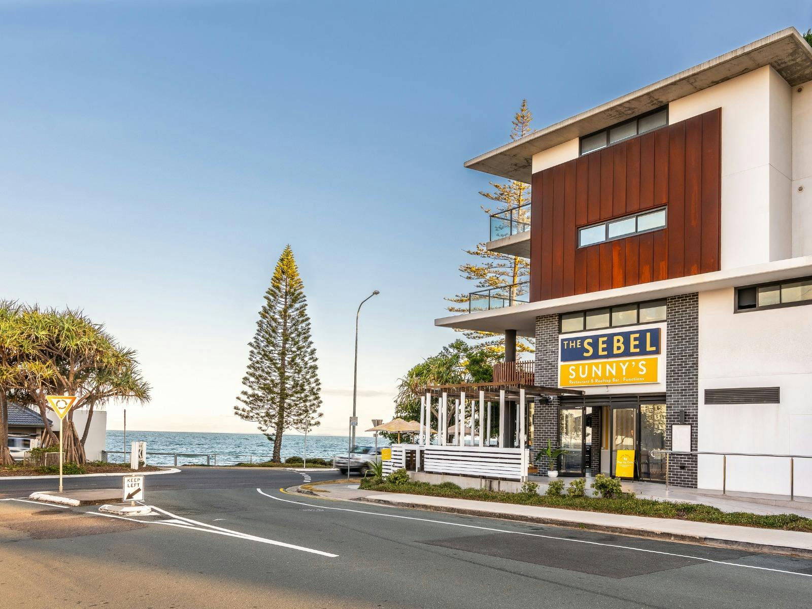 View of building from side street with view of water View of building from side street with view of water