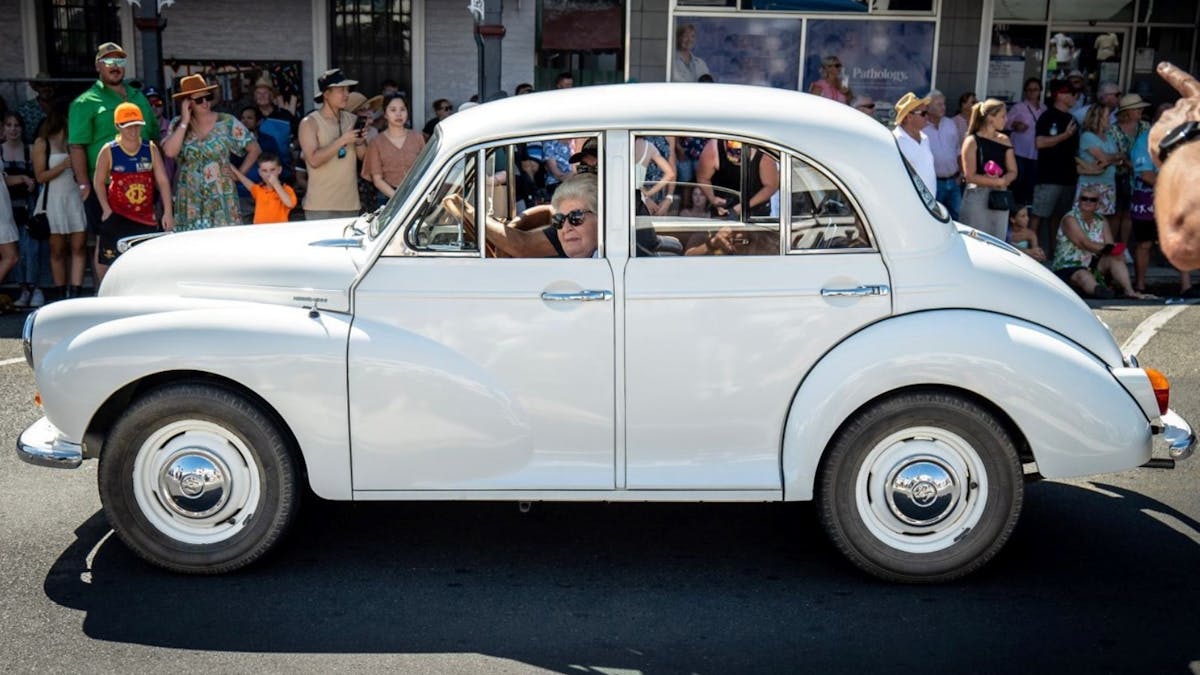 Vintage Tours in Apple & Grape Harvest Festival Parade with patrons lining the streets