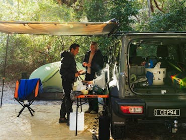 A close up of a campsite with campers A close up of a campsite with campers