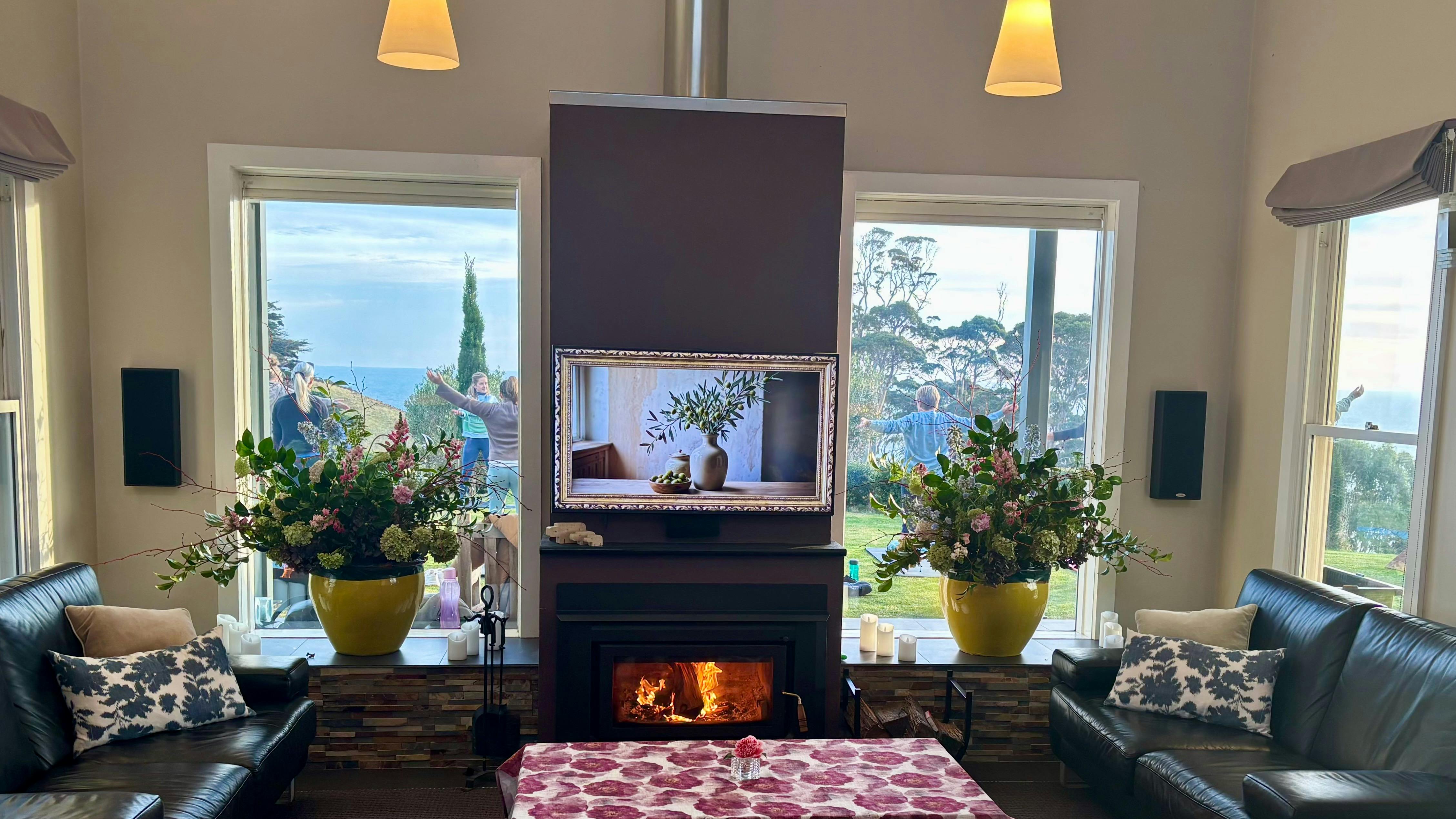 Looking through Table House windows, fire lit inside  ready for breakfast