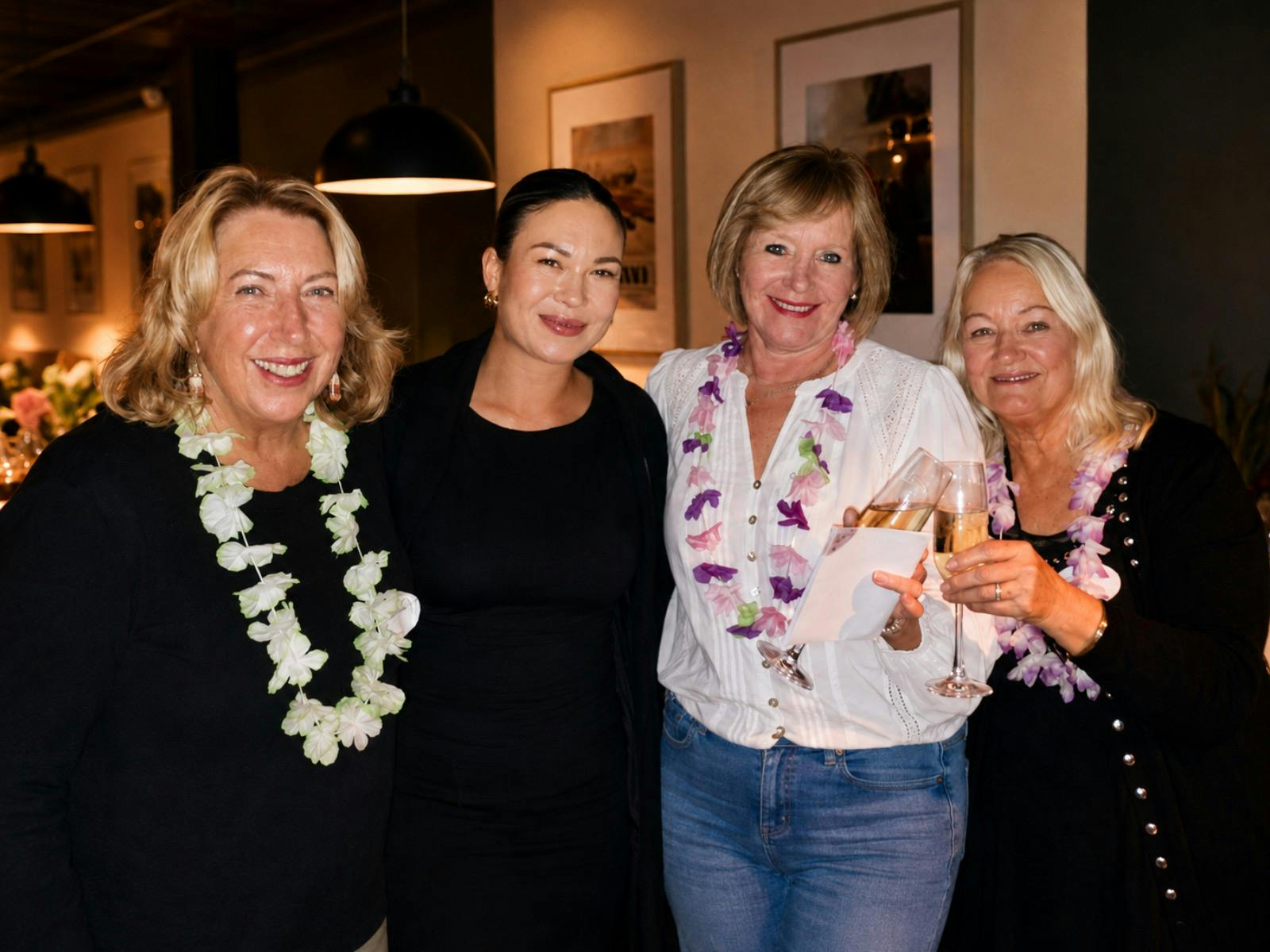 Four women smiling together at a previous Liberté Ladies Evening Out in Batemans Bay