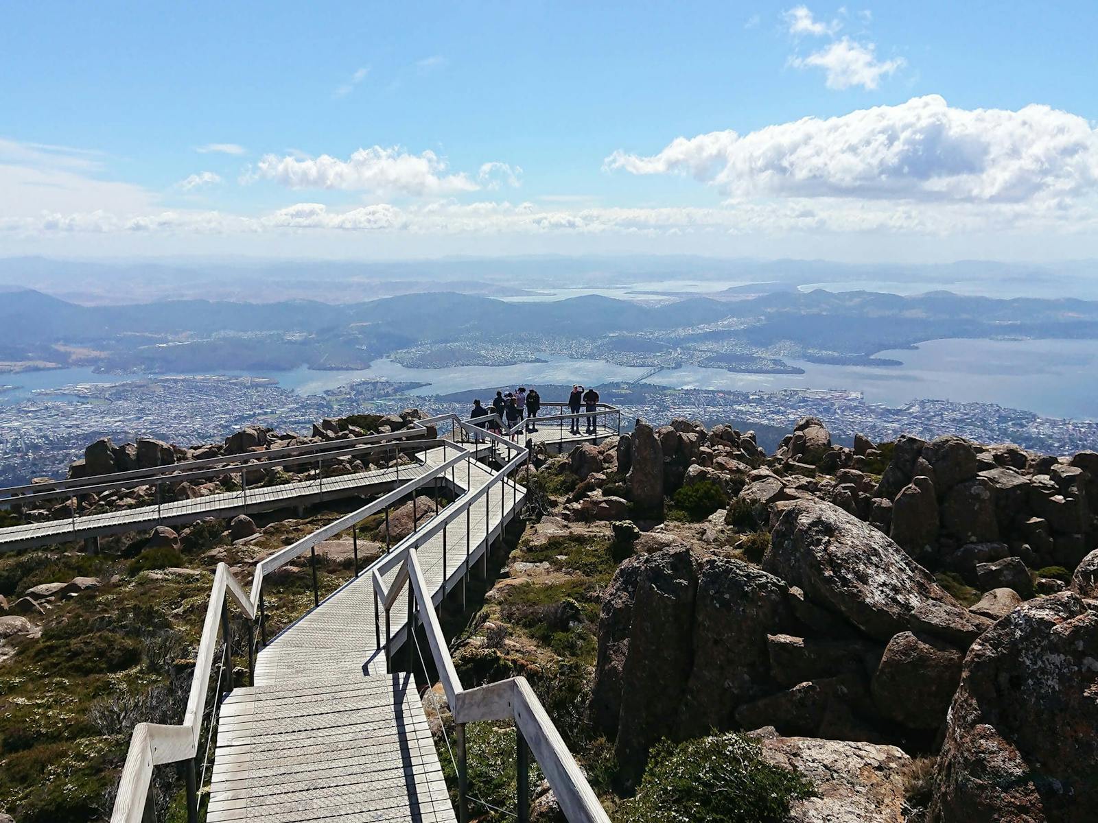 People at the The Pinnacle lookout, kunanyi/Mt Wellington.