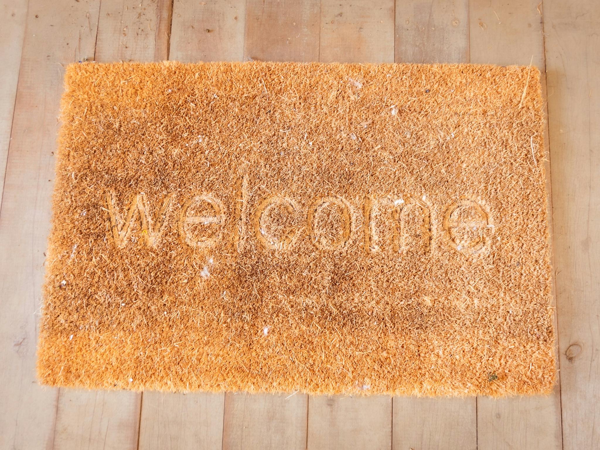Door mat showing the word 'Welcome'