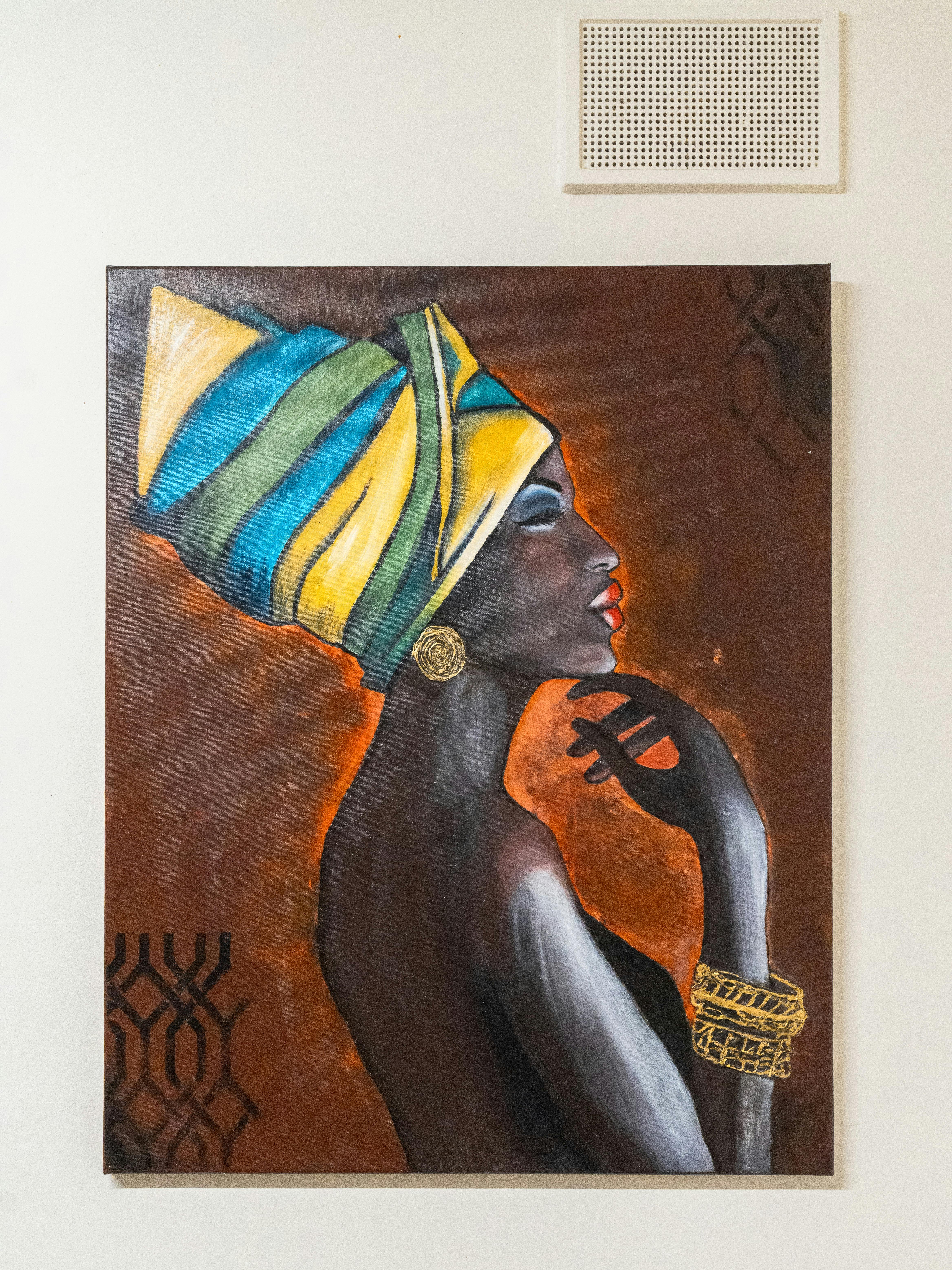Painting of a woman in profile wearing a colourful headwrap and gold jewellery.