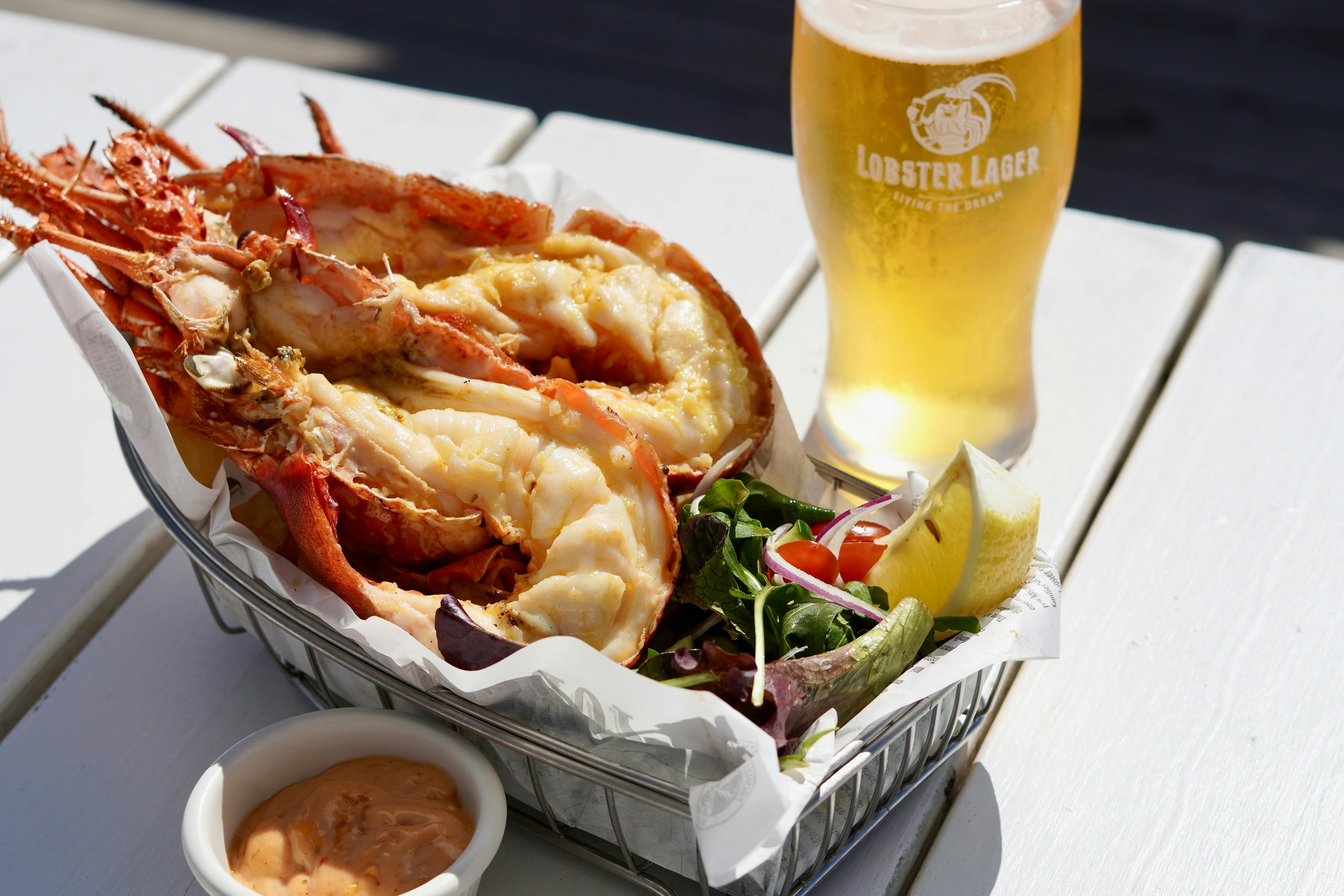 Whoel Grilled Lobster Meal served with Chips and Salad and a Lobster Lager