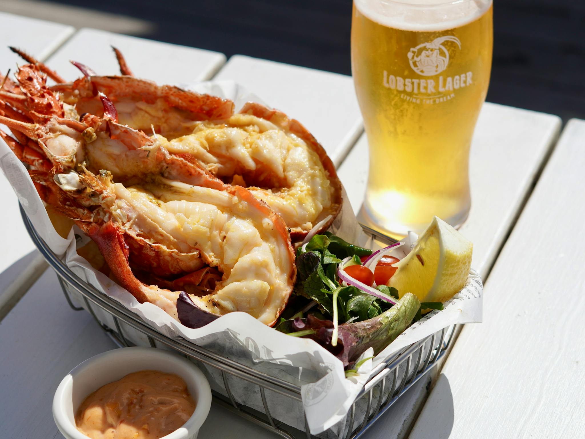 Whoel Grilled Lobster Meal served with Chips and Salad and a Lobster Lager