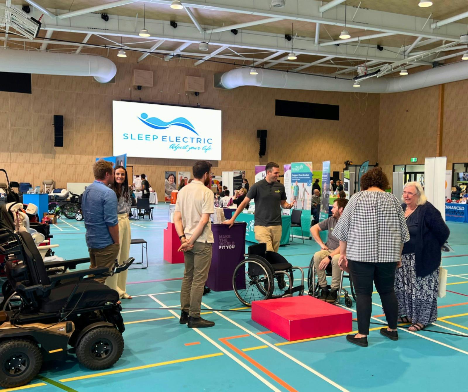 People talking to exhibitors