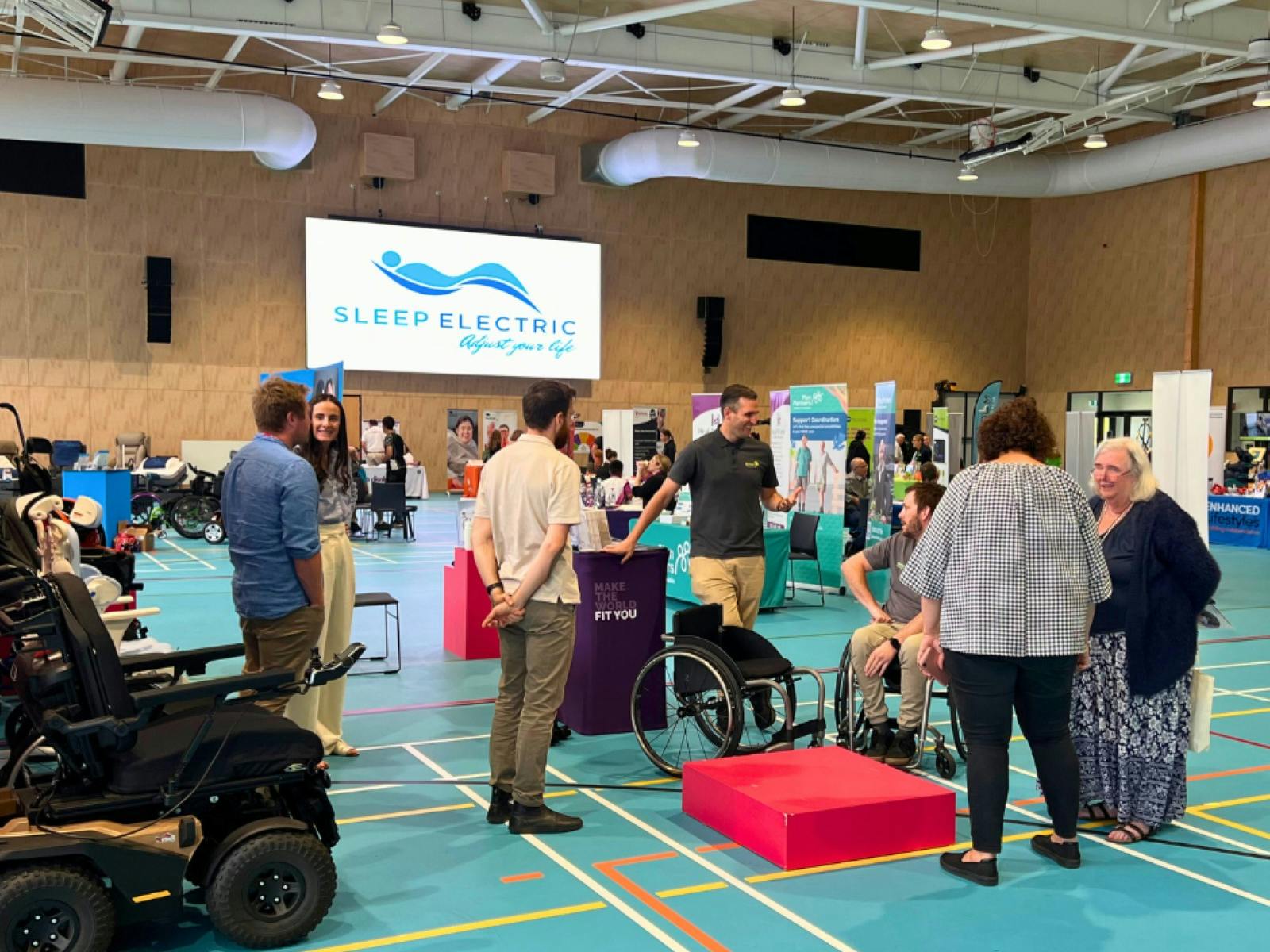 People talking to exhibitors