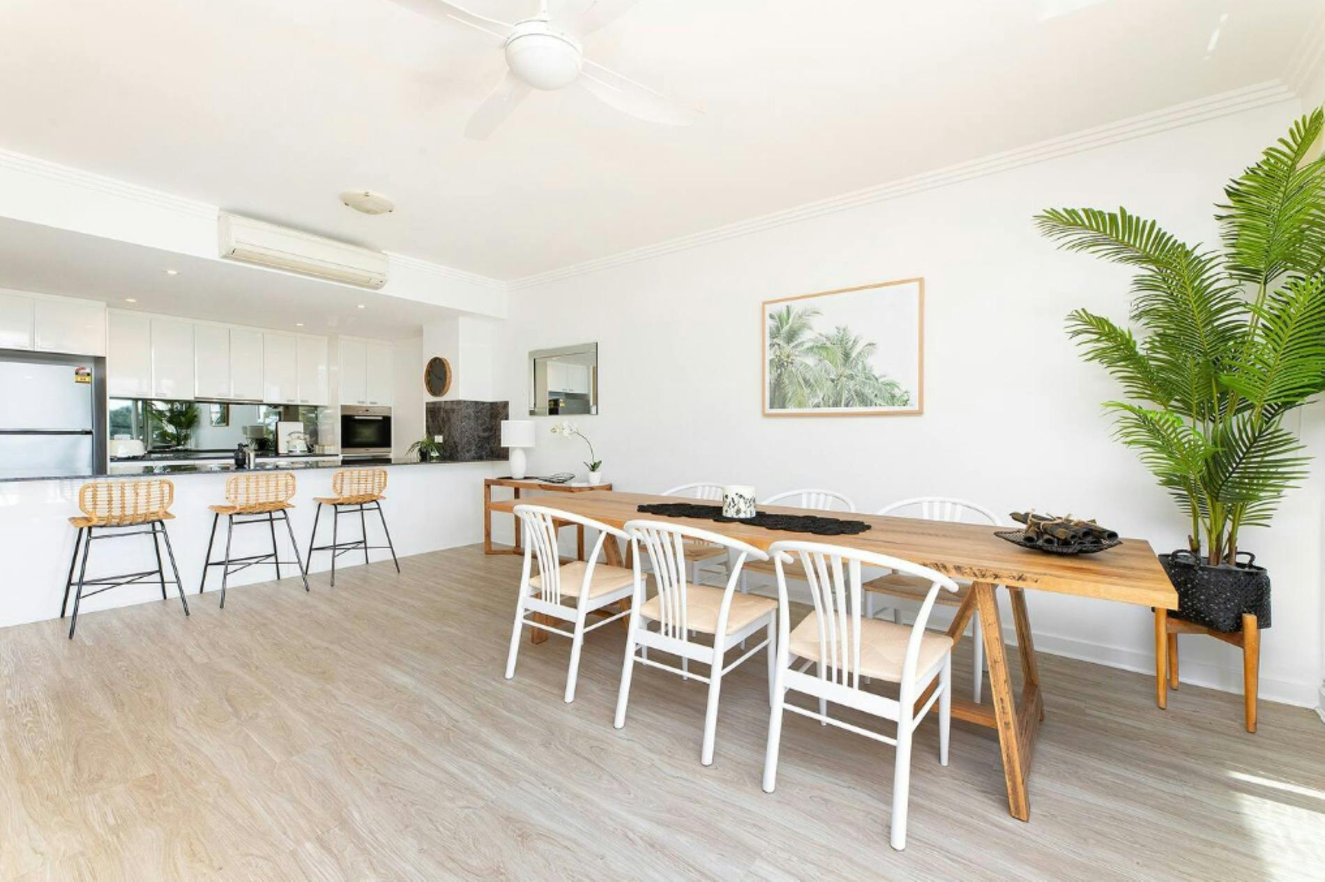 Dining and kitchen area with air-conditioning and ceiling fan