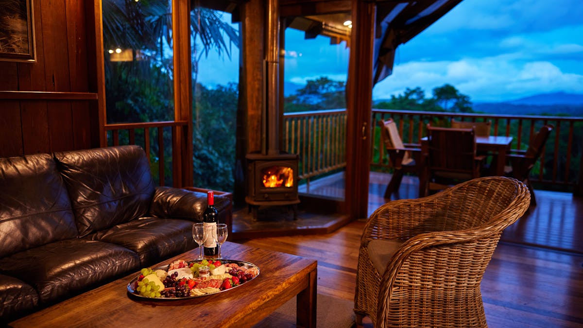 Lit fireplace, with a view of mountains behind.