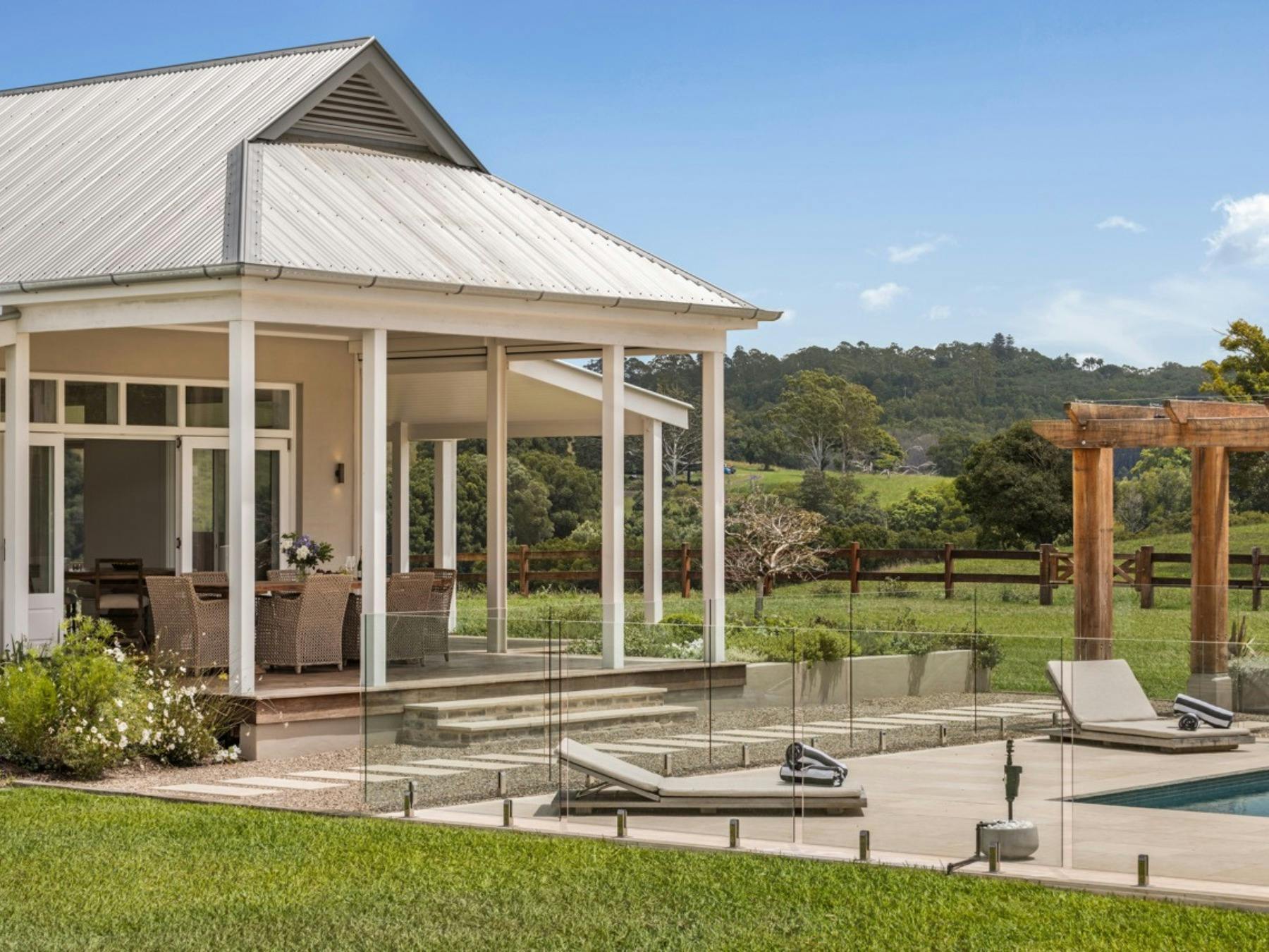Poolside terrace with countryside views at Stonehaven Estate in Possum Creek
