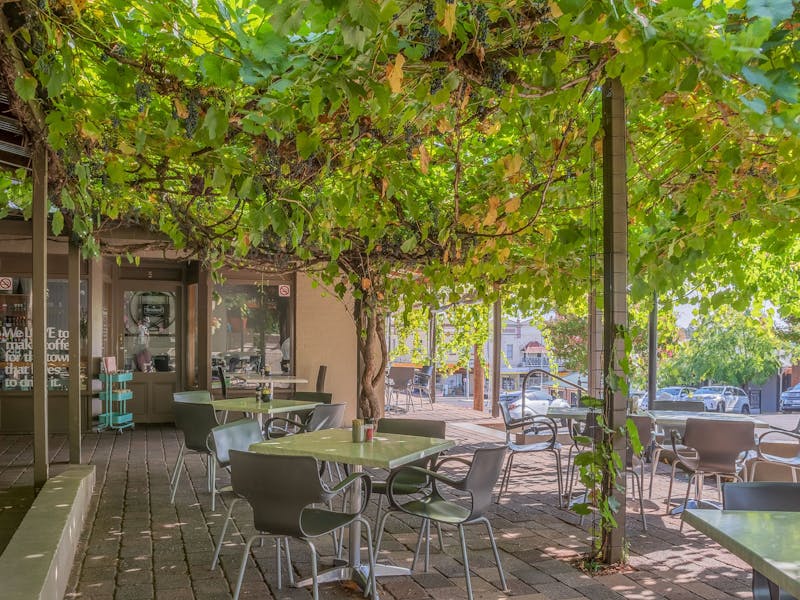 Breakout Brasserie Cafe Cowra outdoor seating under the grapevine