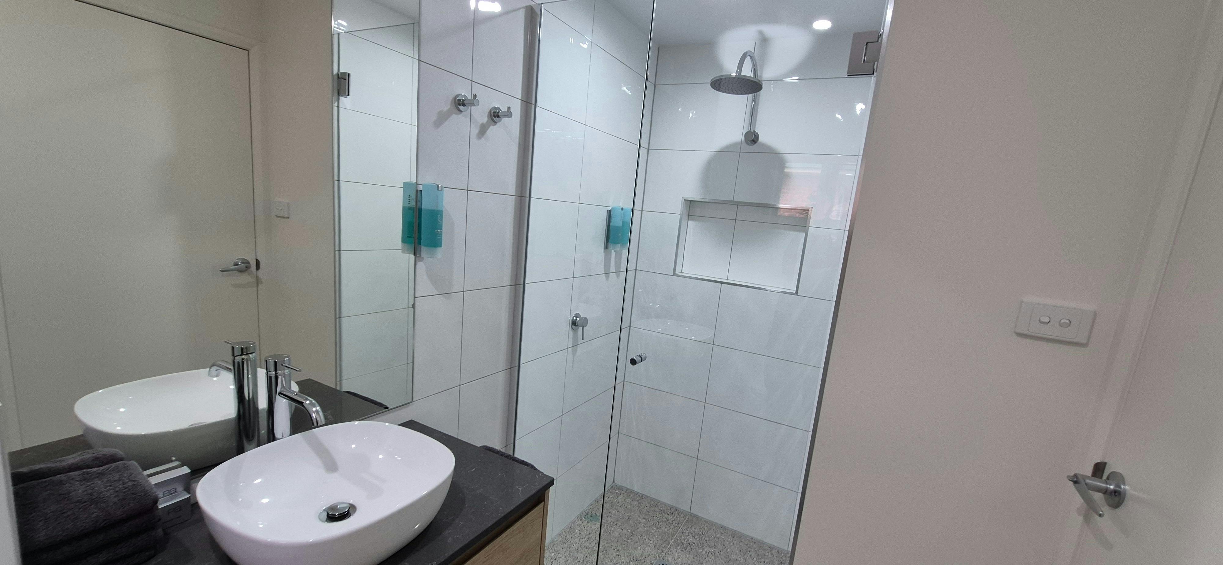 Bathroom with shower, vanity and toilet