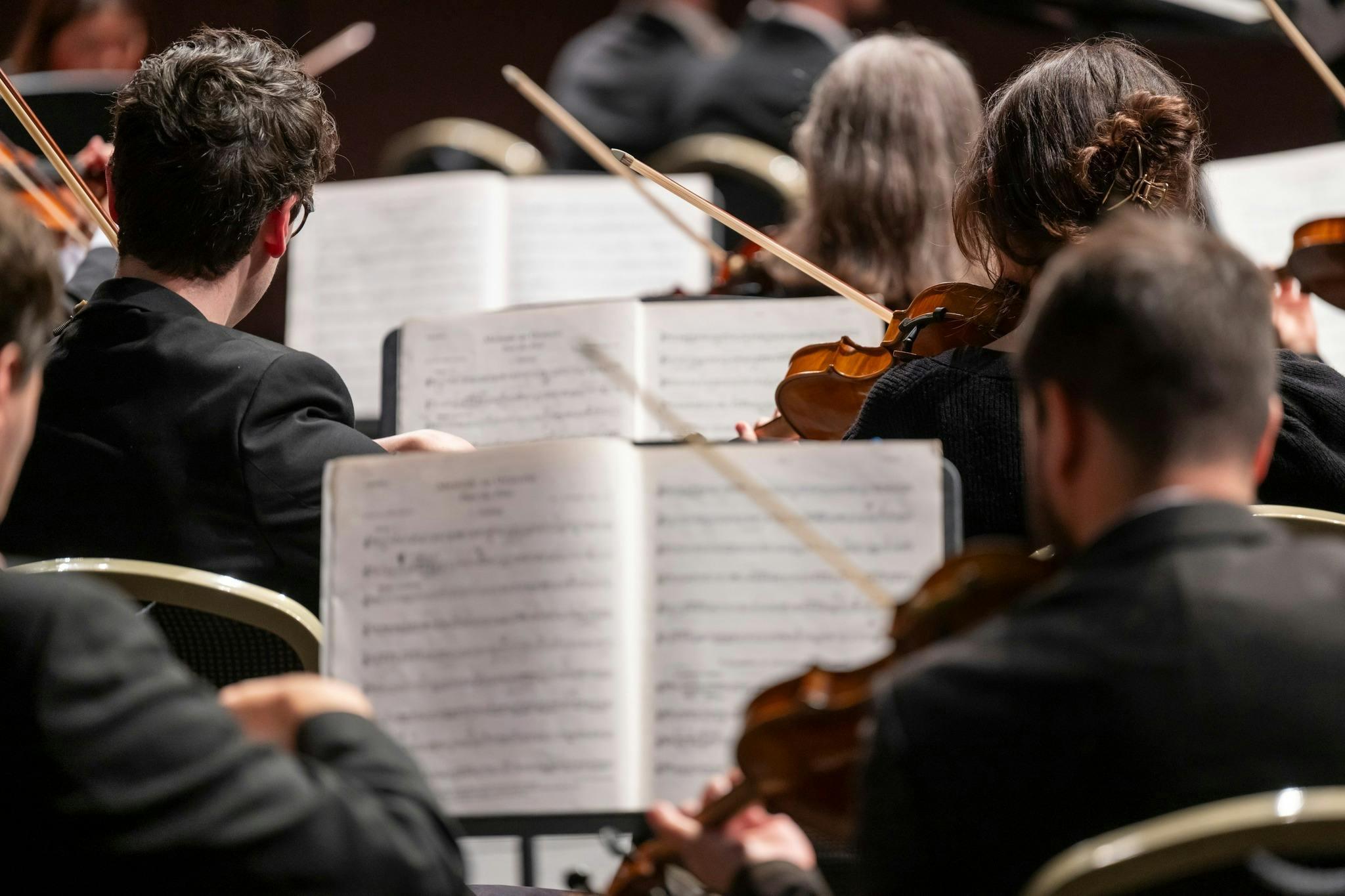 string section of orchestra playing Messiah