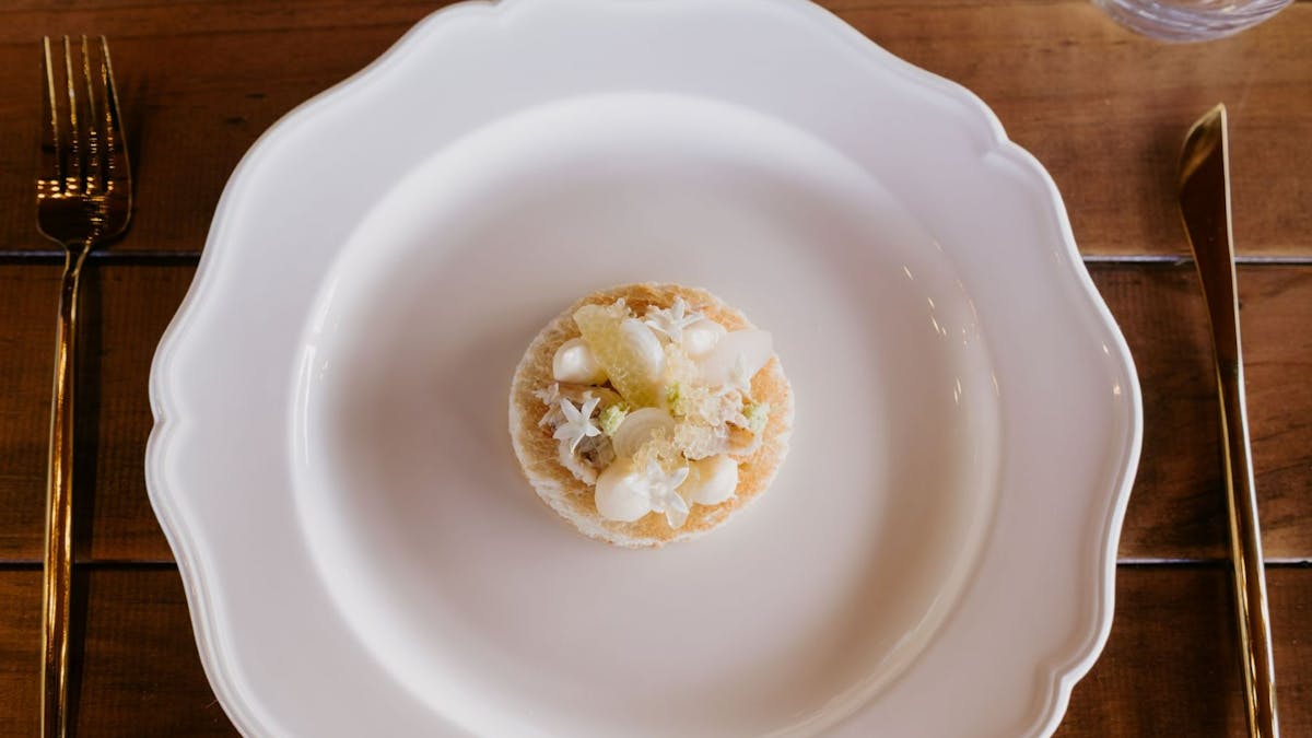 White scalloped plate with dessert