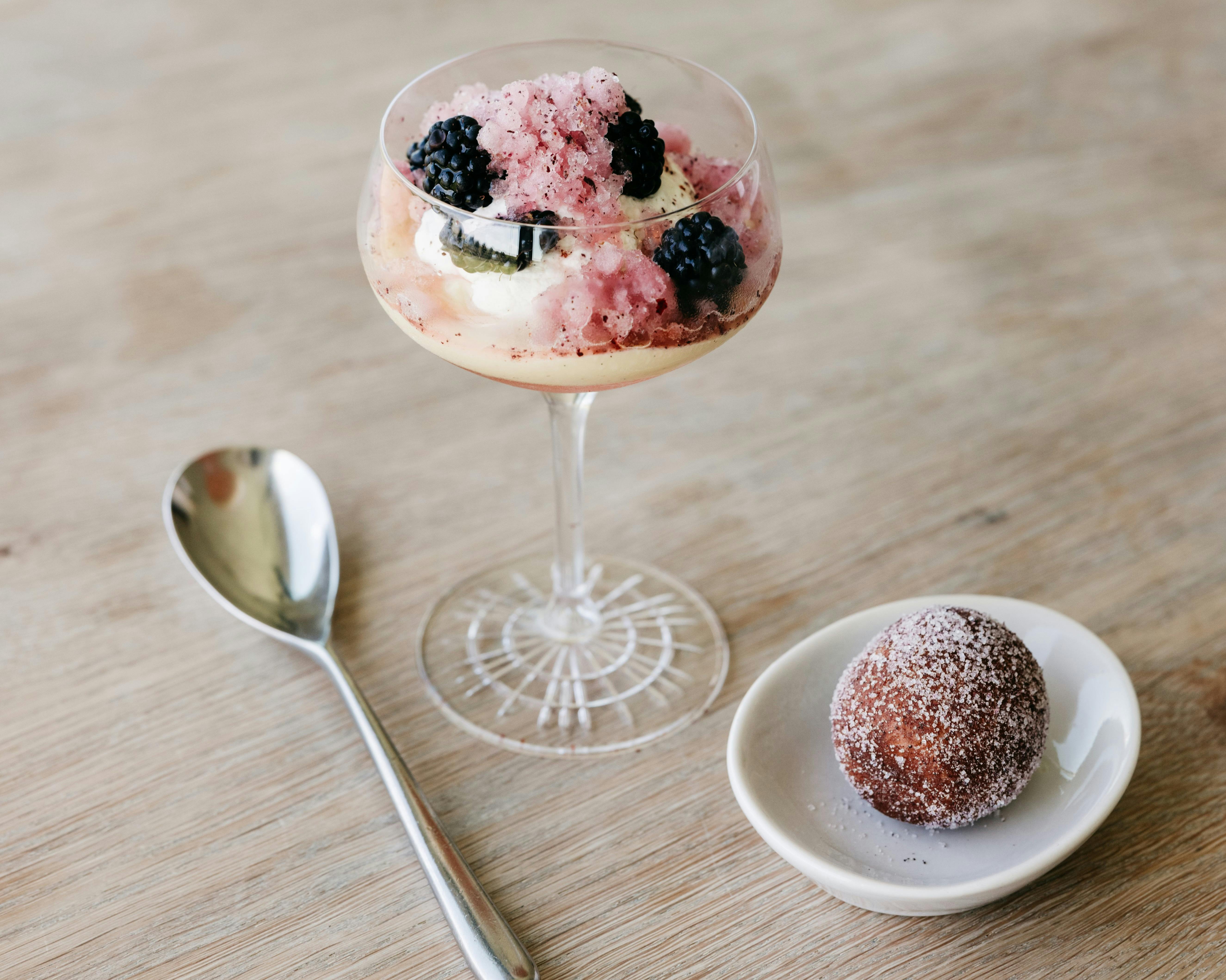 A stemmed glass filled with a berry dessert at Oakridge Restaurant