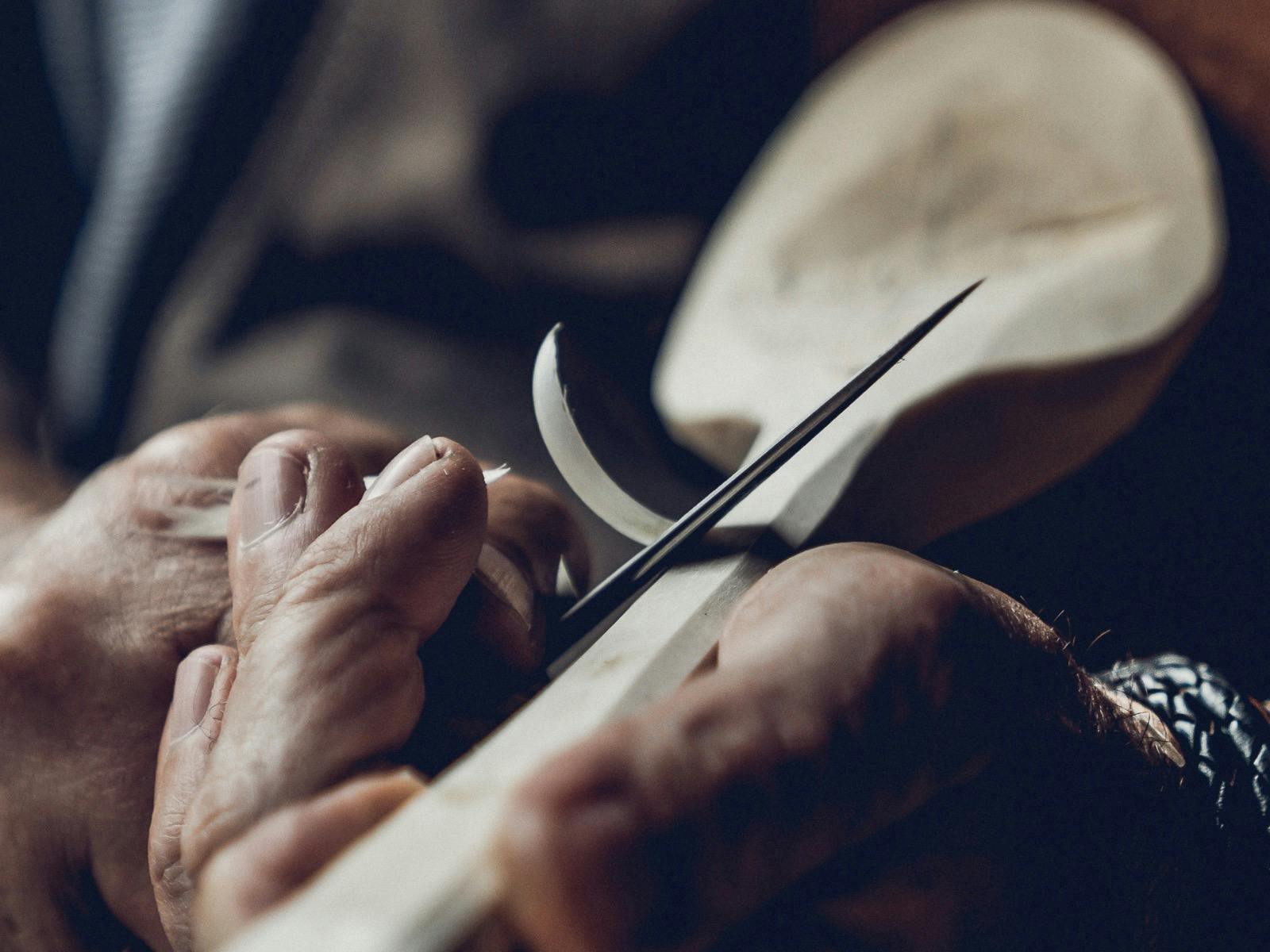 Wooden spoon being hand carved