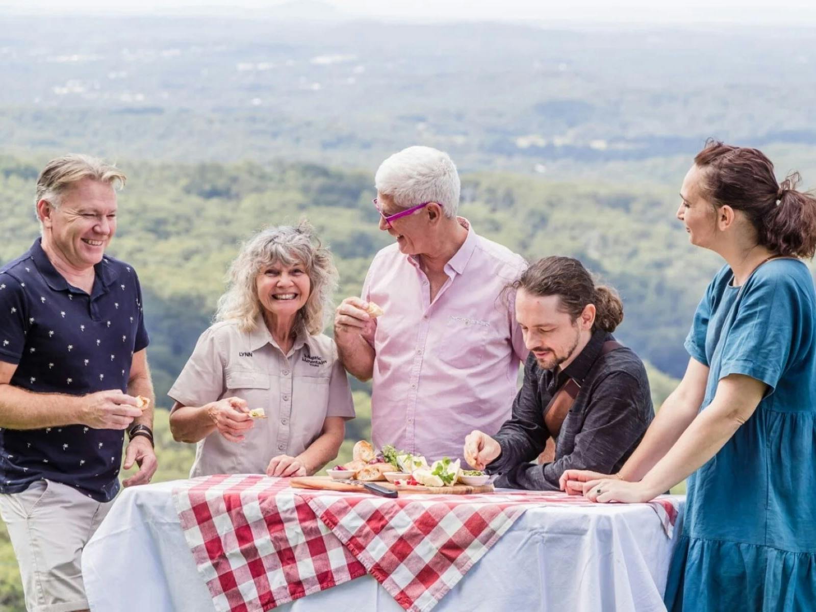A tour group enjoys a picnic on the Range